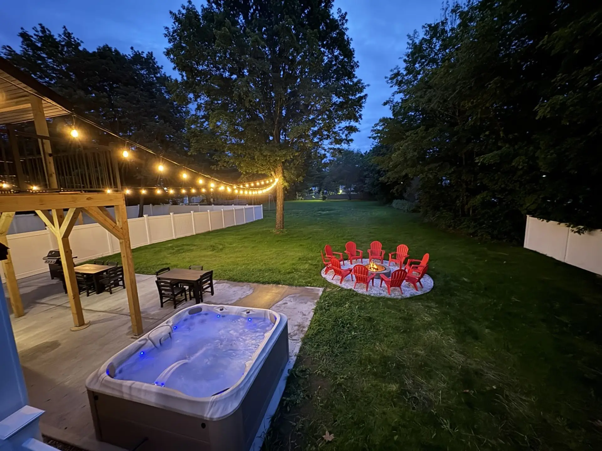 Big House: Large flat fully fenced in yard complete with a hot tub, fire pit, grill, swing set, and more