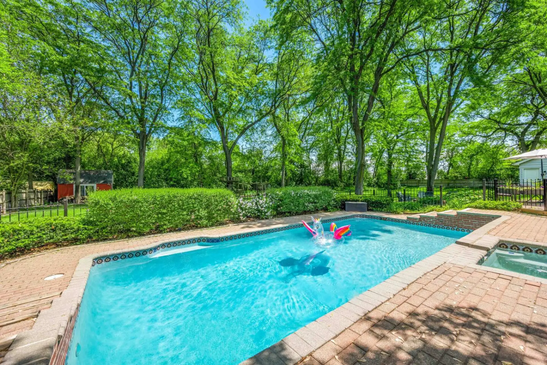 Private heated saltwater pool and hot tub (surrounded by a fence for safety)