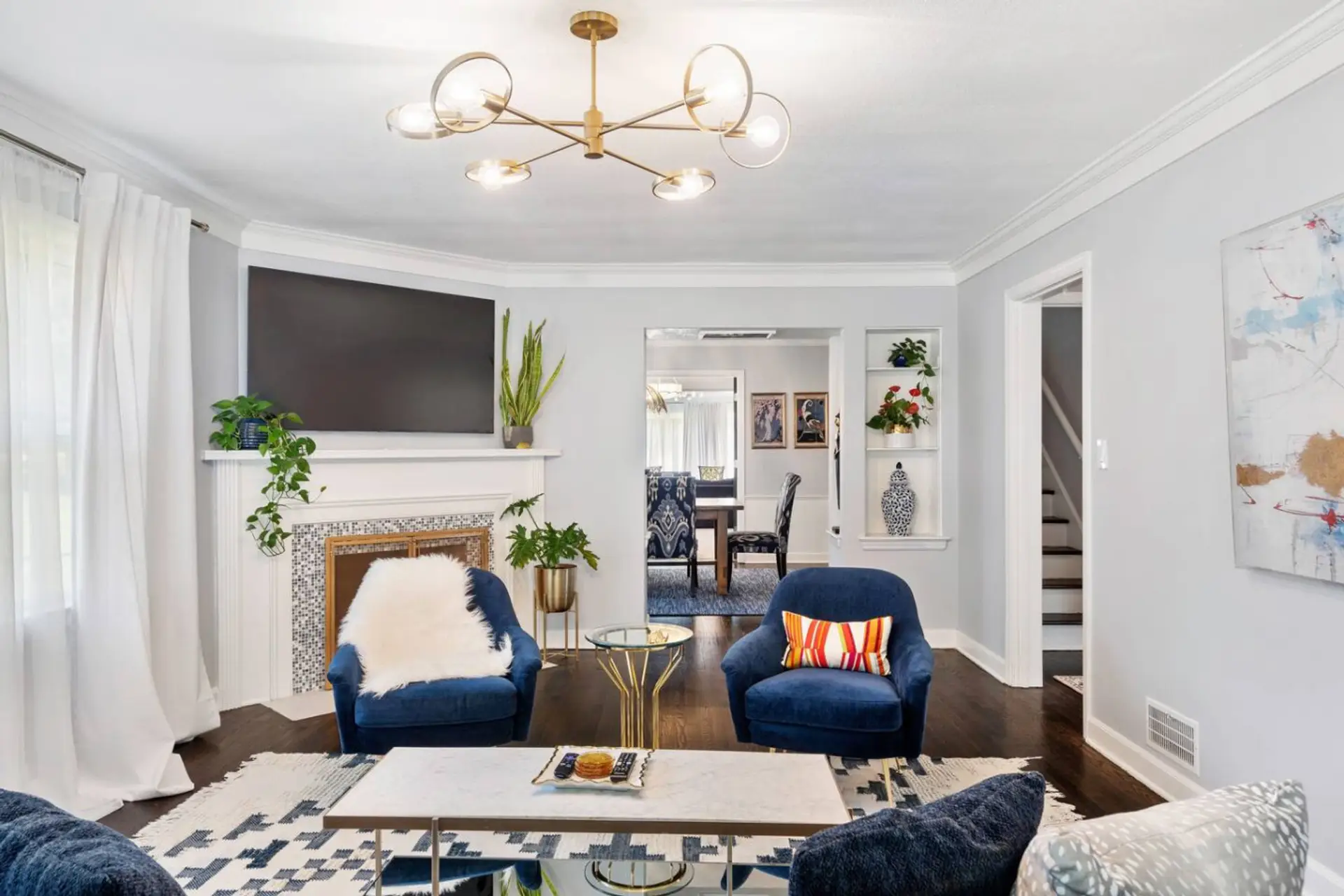 Beautifully decorated living room, opening into the dining room which leads into the family room