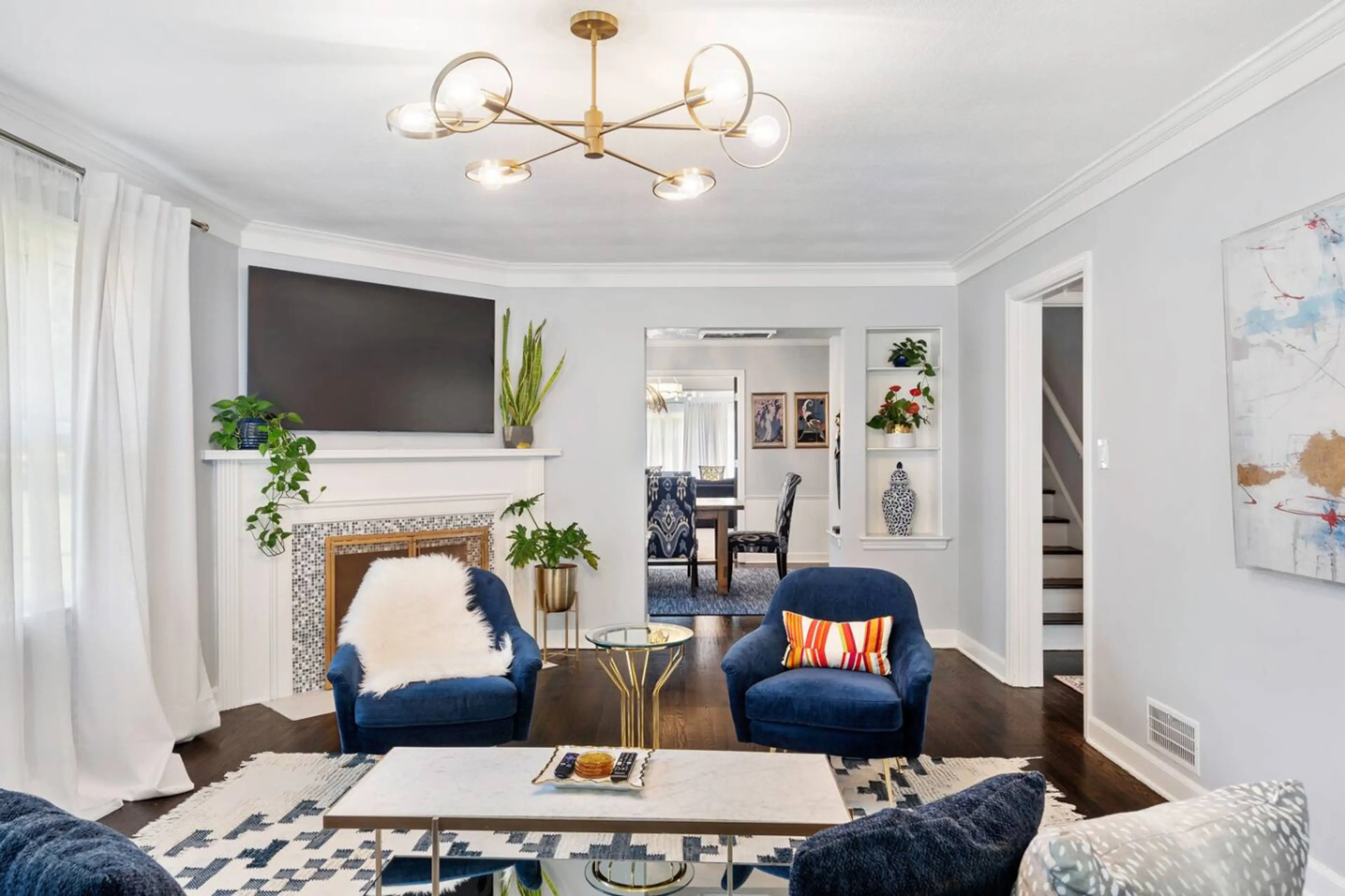 Beautifully decorated living room, opening into the dining room which leads into the family room