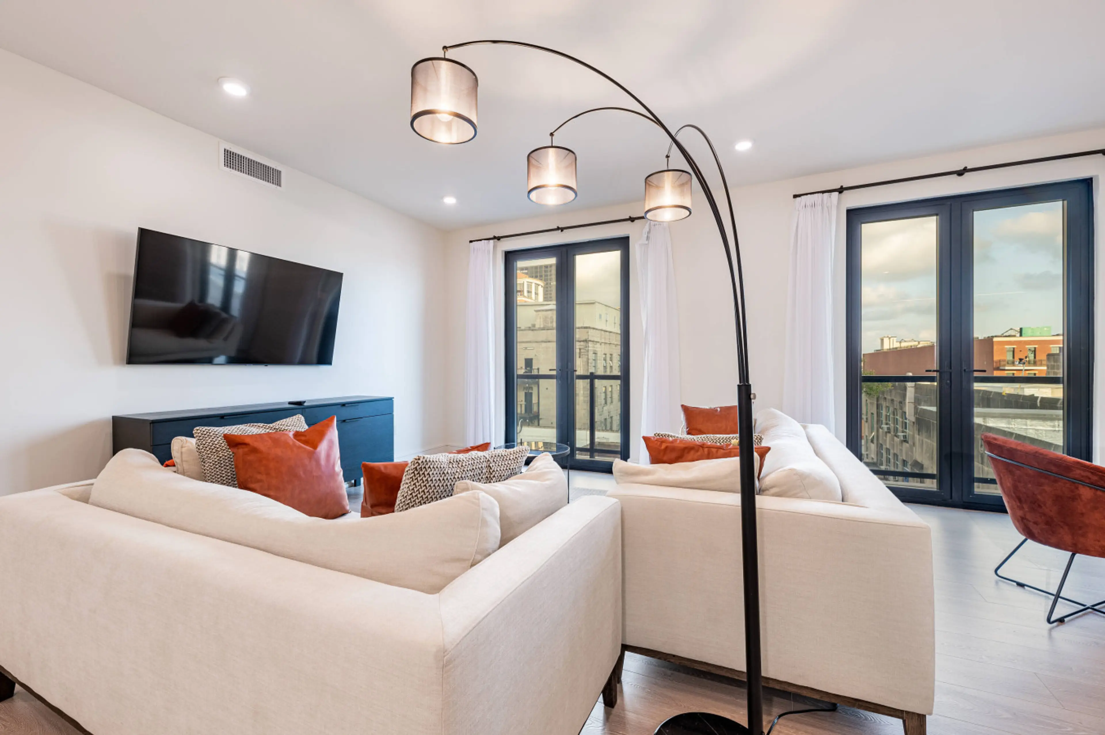 Spacious Open Concept Living Room with Comfortable Seating + Smart TV