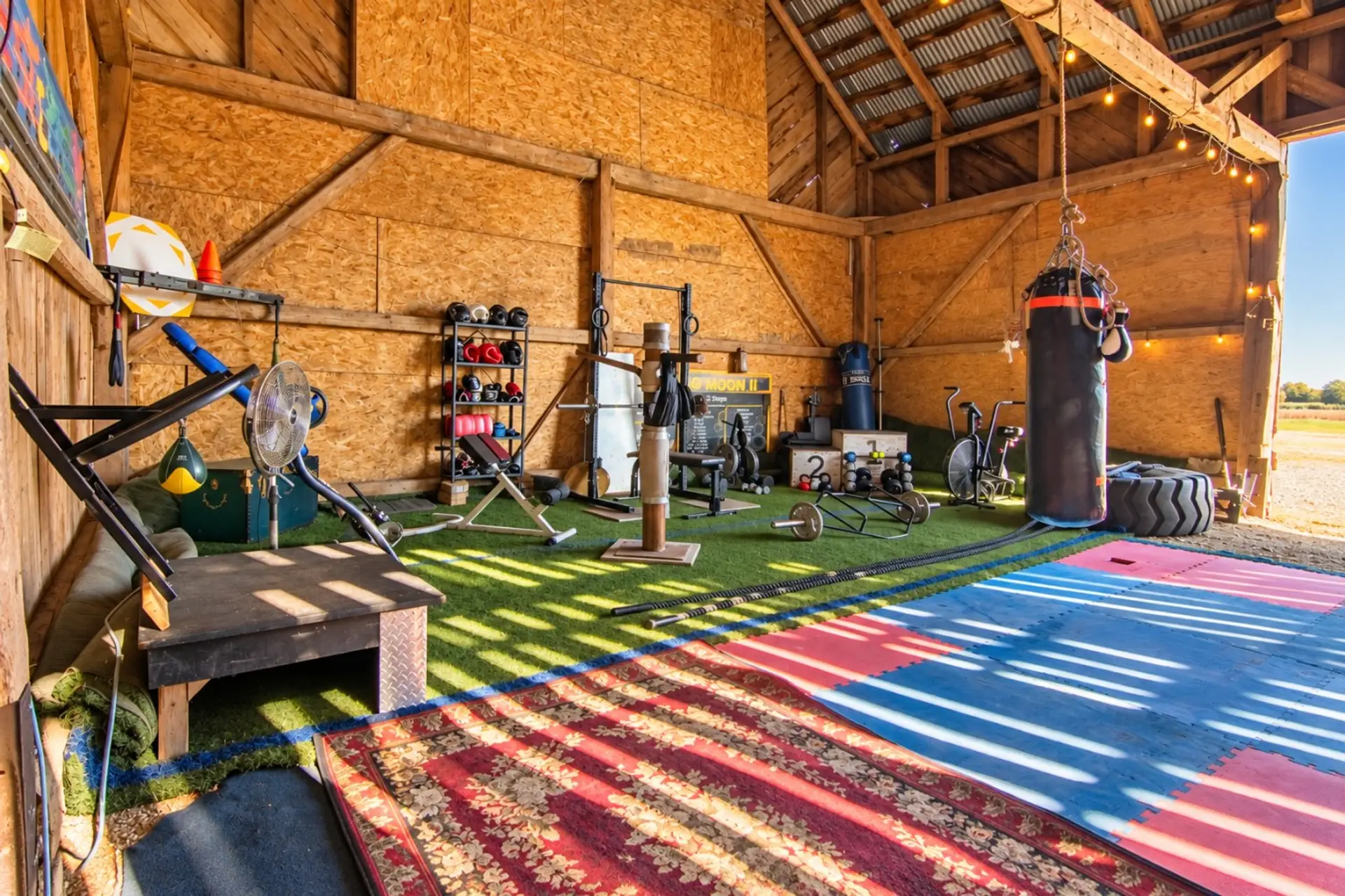 Rustic barn gym with boxing and workout equipment