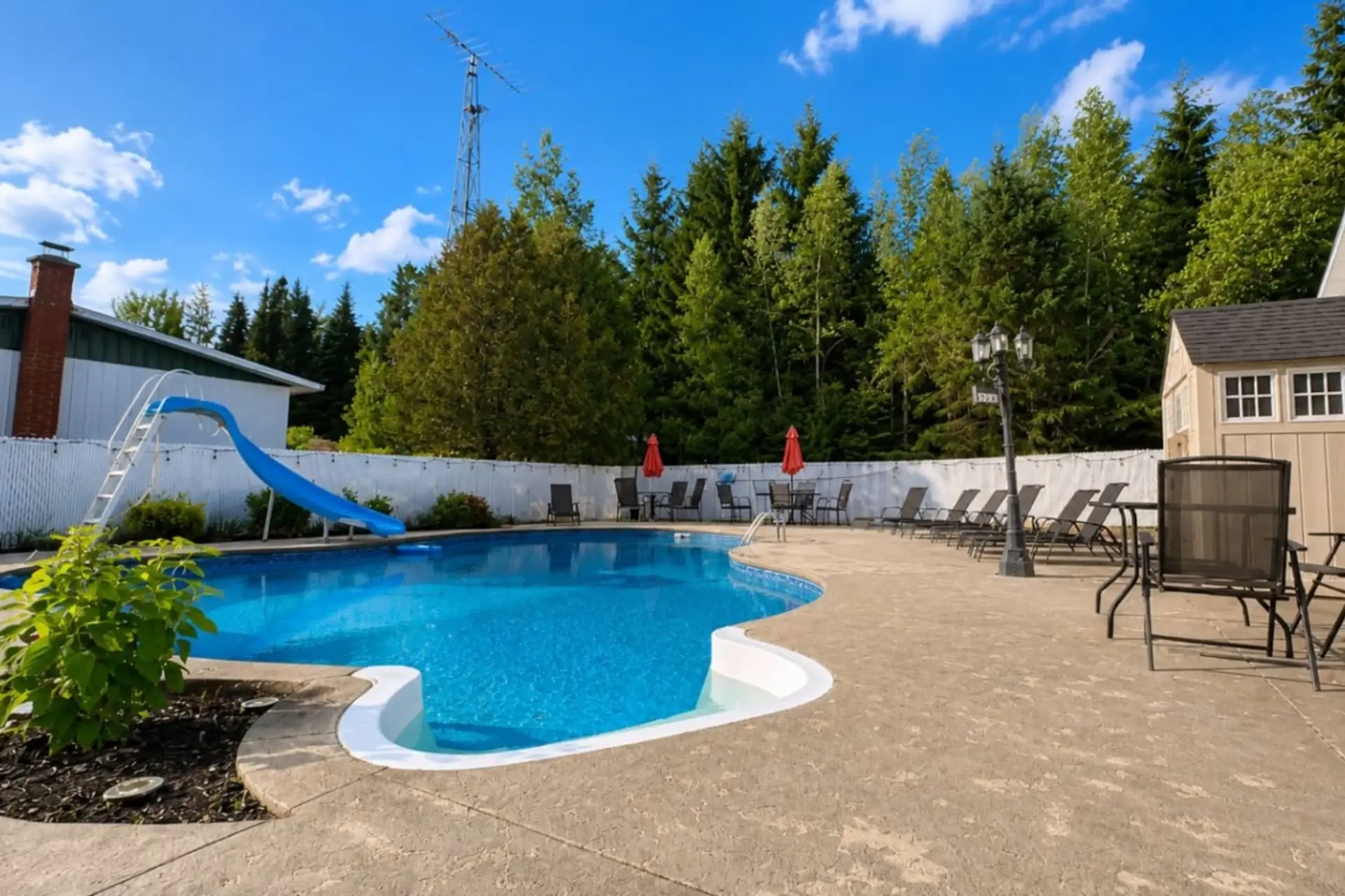 Private pool with waterslide and sunny resort-style vibes