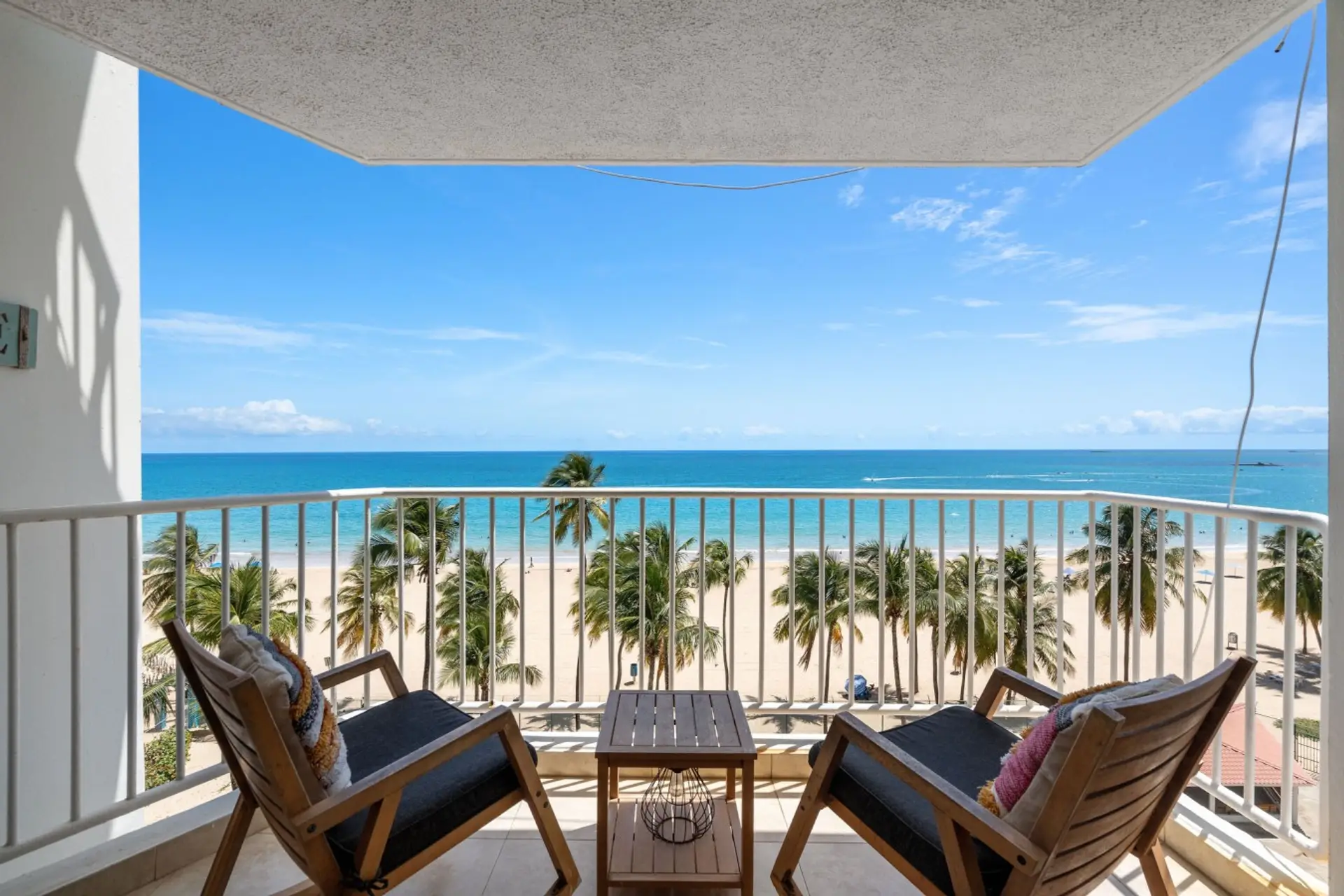 Private oceanfront balcony — the perfect spot for morning coffee or sunset drinks.
