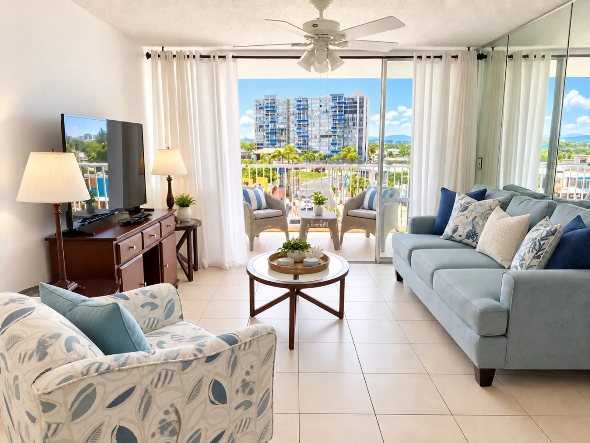 Bright living room with balcony and city views.