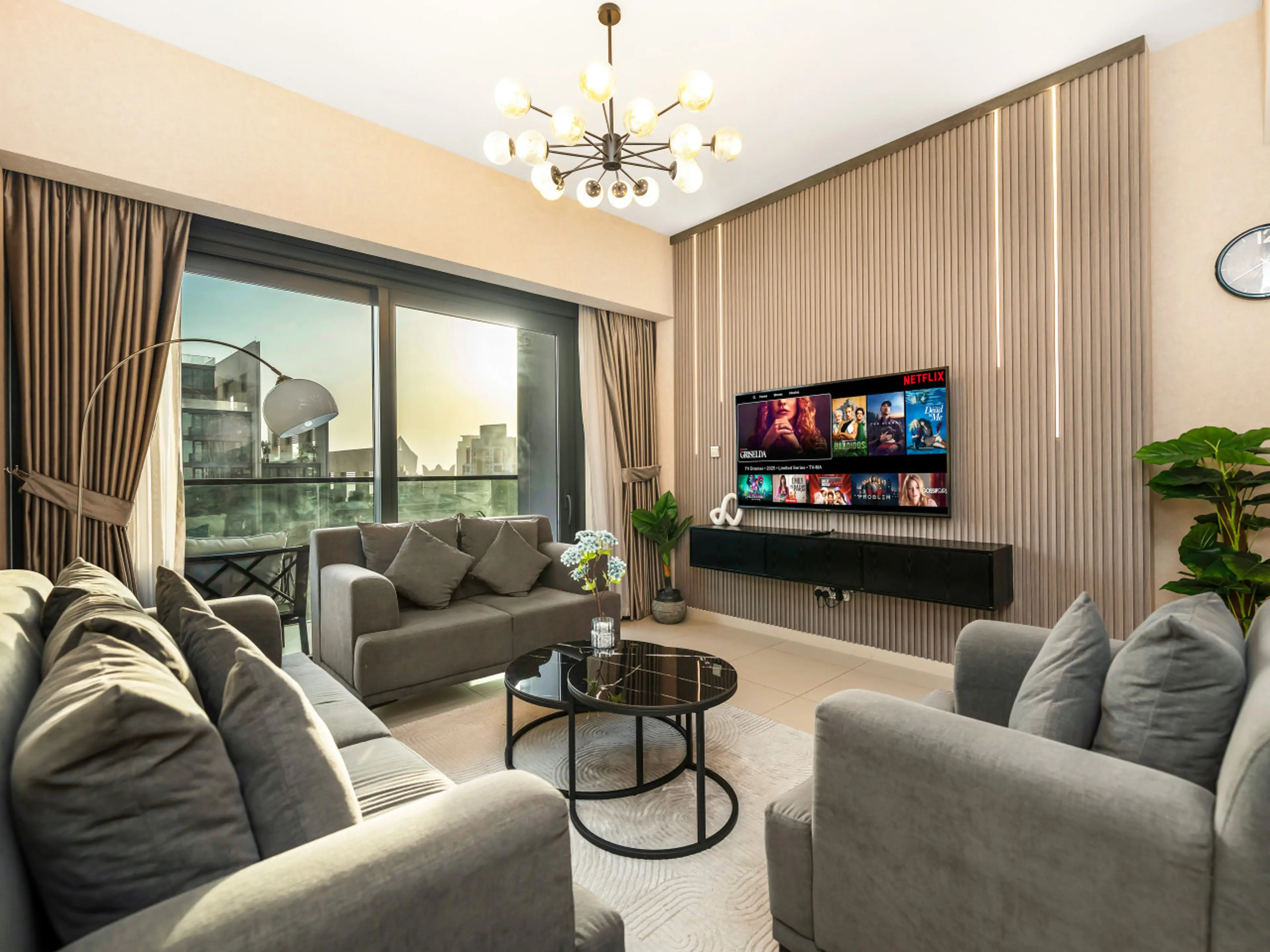 Chic Living Room: Bright and stylish space with stunning skyline views, perfect for relaxation and fun!