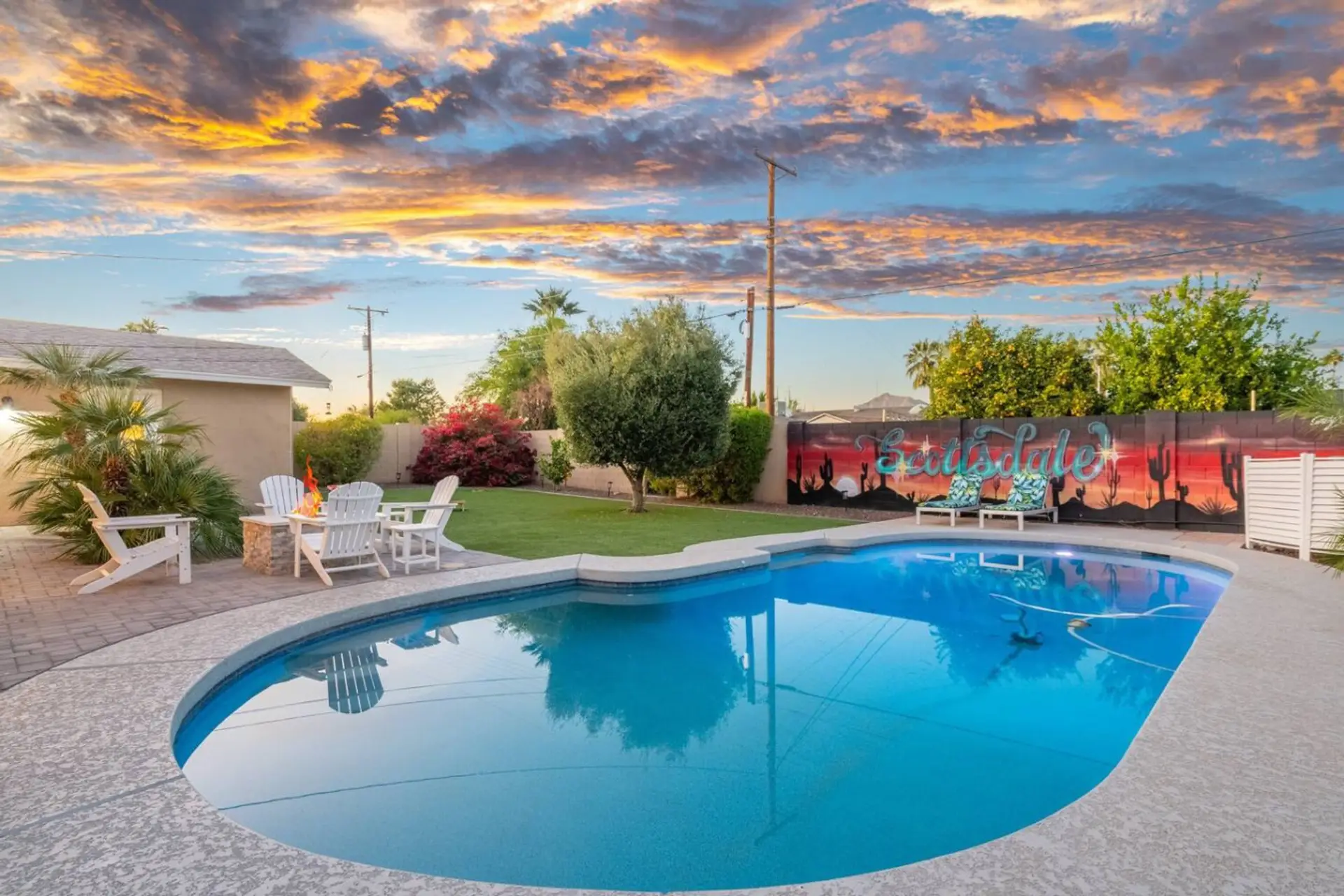 A colorful Arizona sunset reflected in the pool creates the perfect backdrop for laid-back afternoons and evening swims.