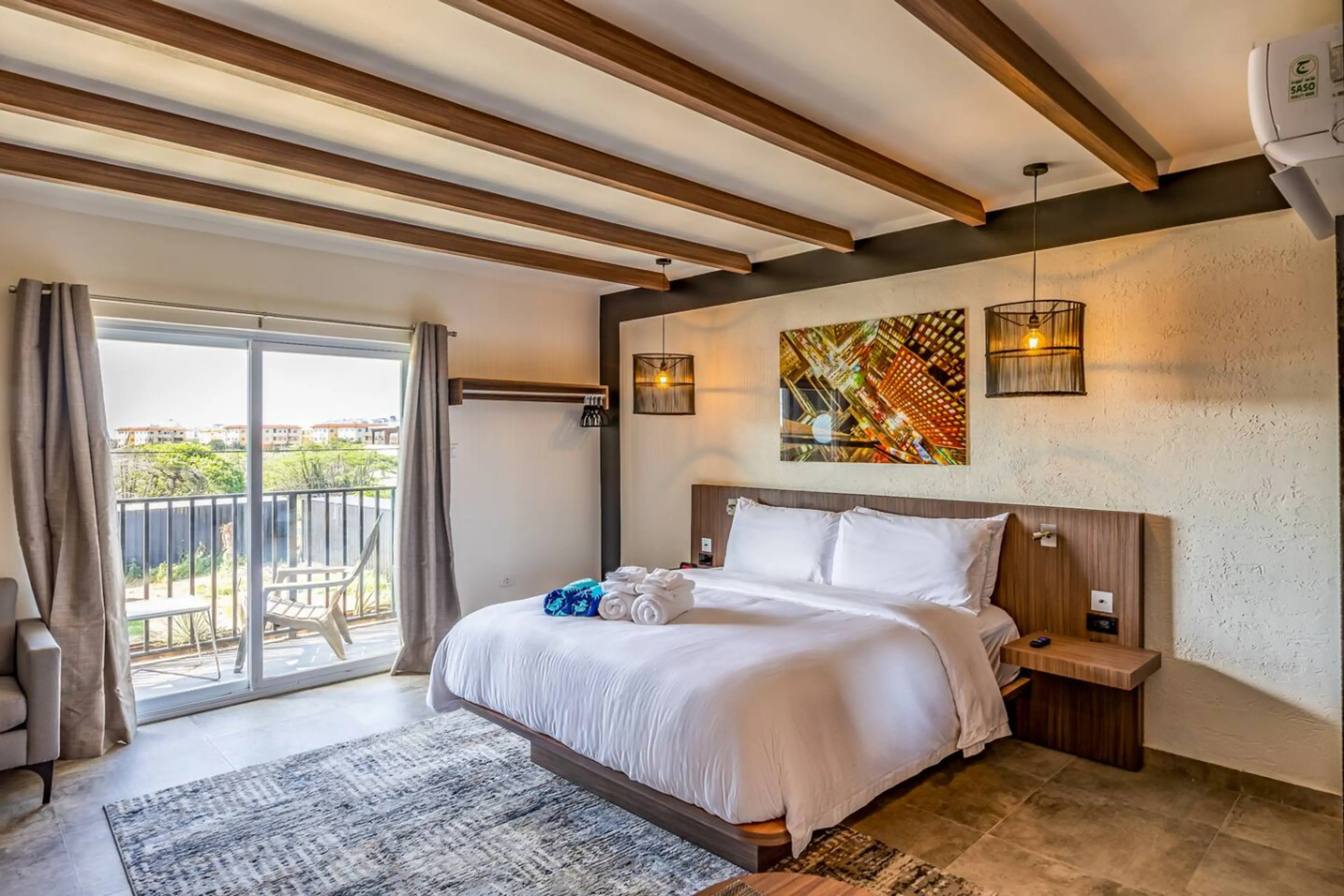 Cozy sleeping space accommodating up to 2 guests with a King-size bed. Adorned with four pillows for added comfort.