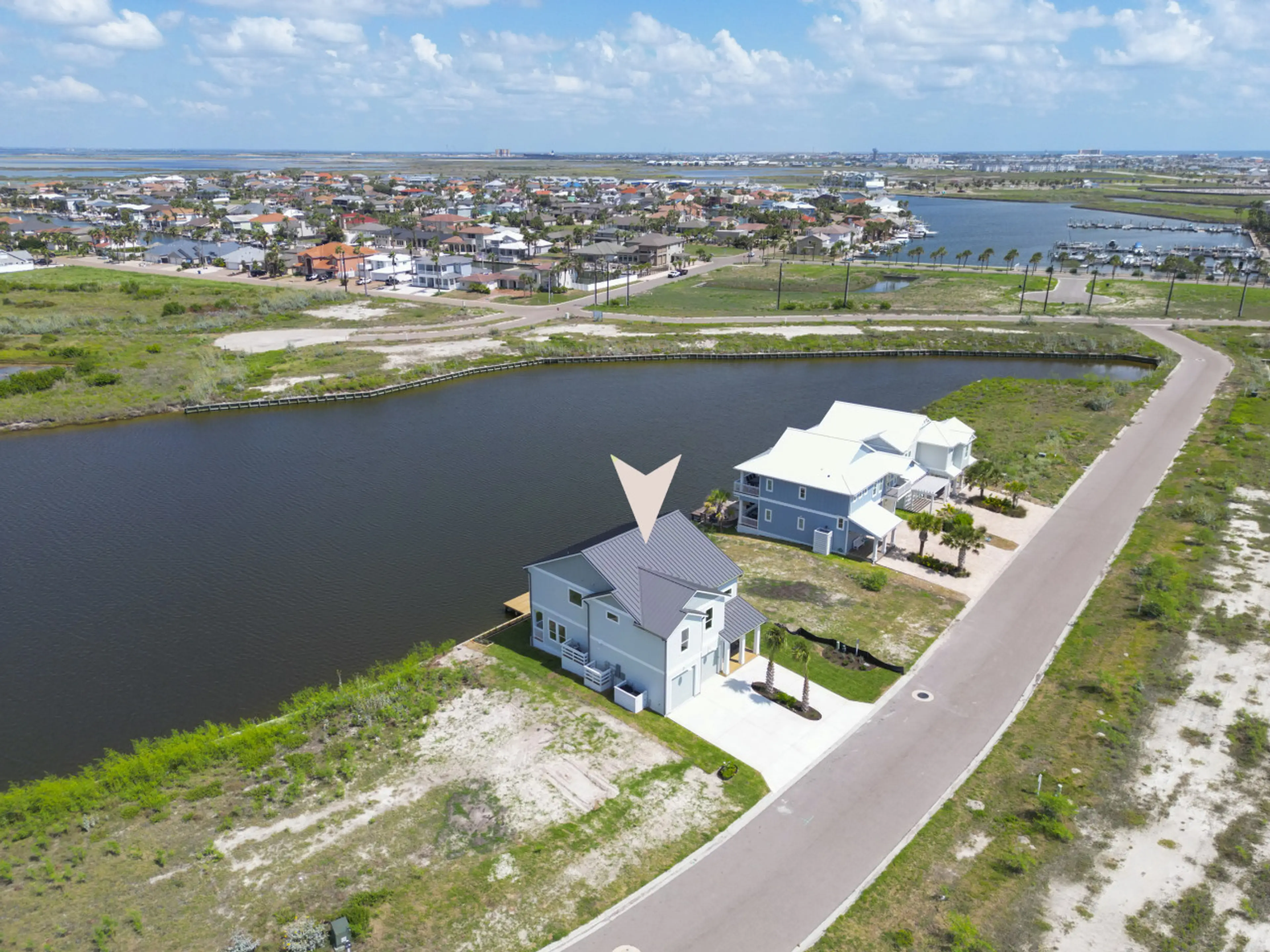“Bird’s-eye view of your serene getaway – steps from the water and surrounded by coastal charm.”