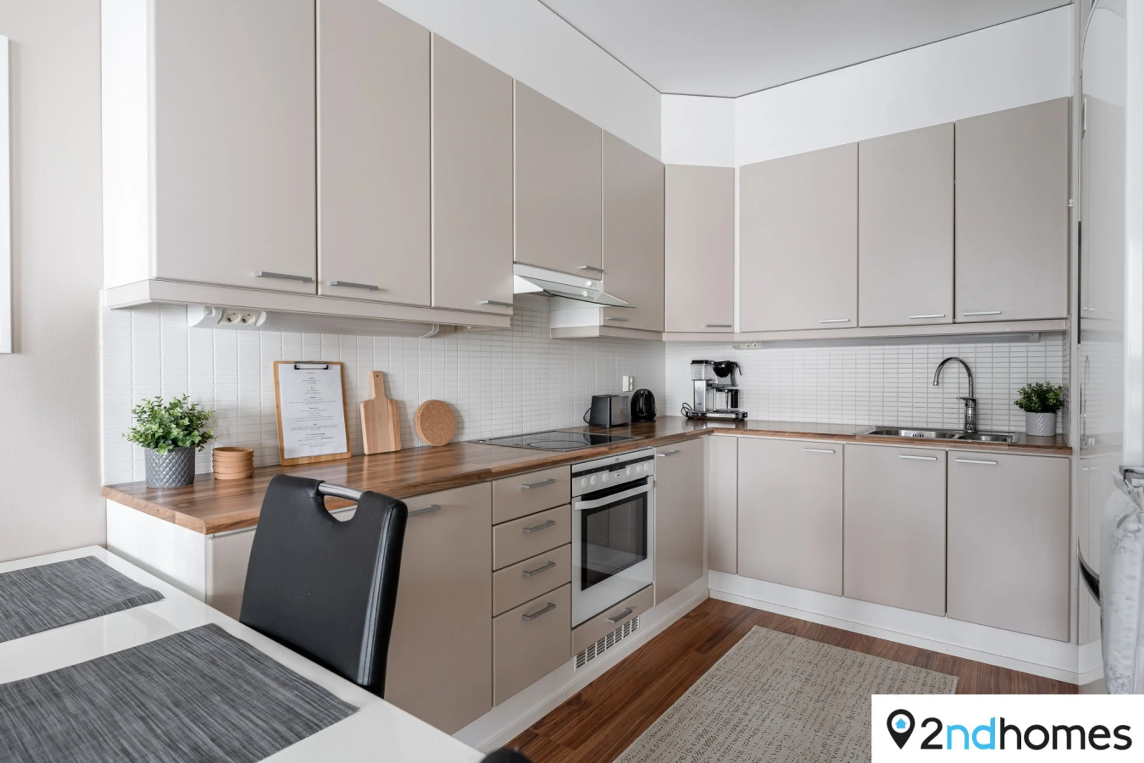The kitchen is well equipped with cooking ware.