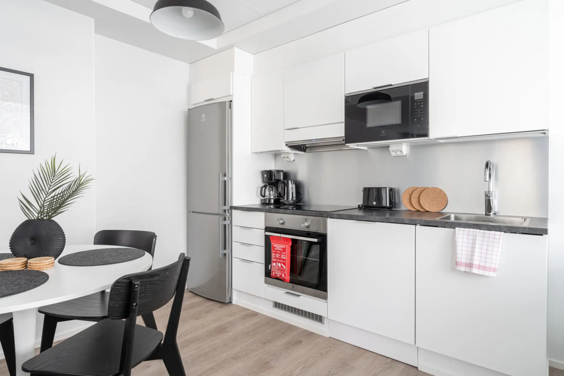 The kitchen is fully equipped with modern appliances and essentials, making it easy to whip up everything from morning coffee to a full dinner.