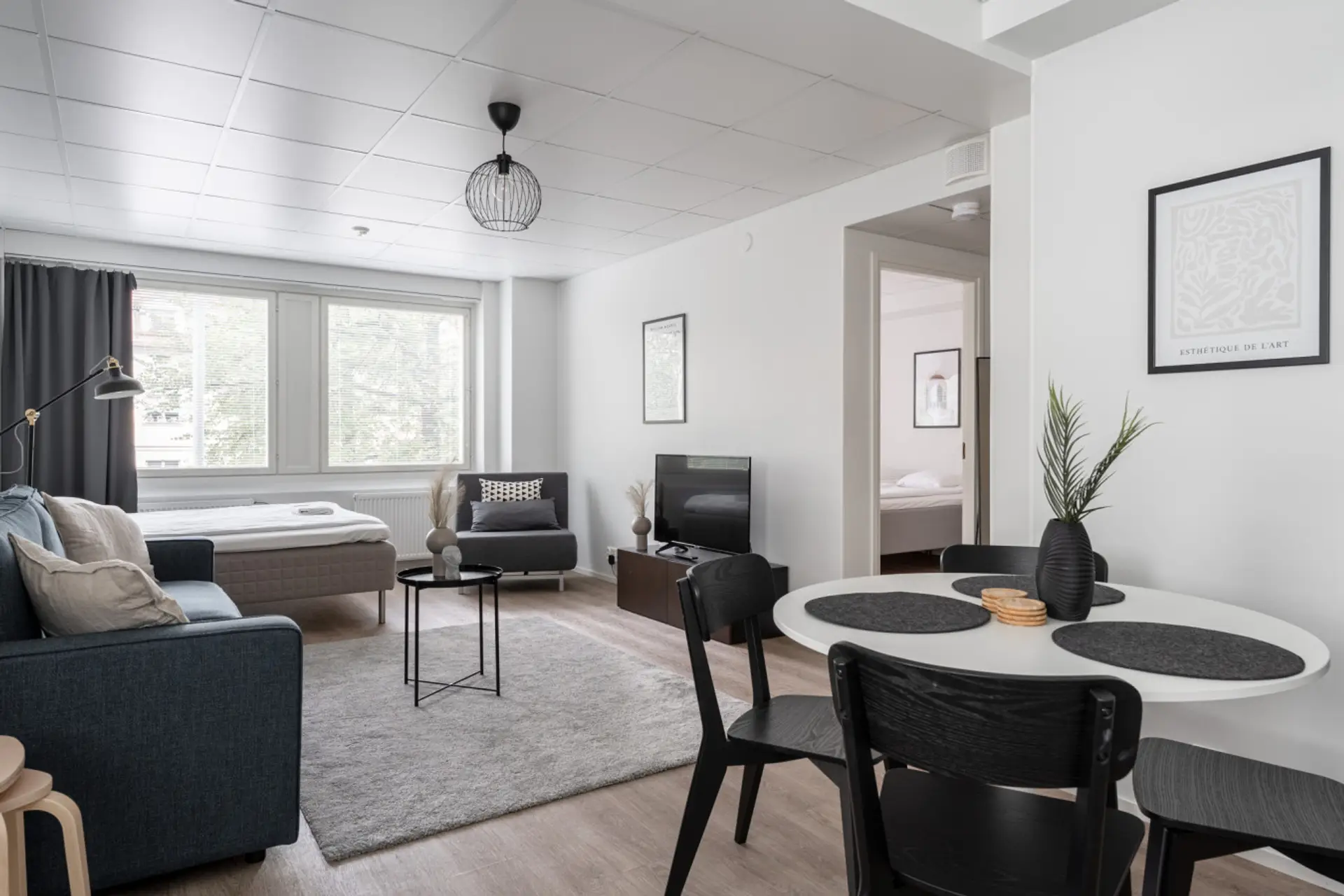 The open layout creates a social atmosphere, allowing you to chat with friends while preparing a meal or relaxing on the sofa.