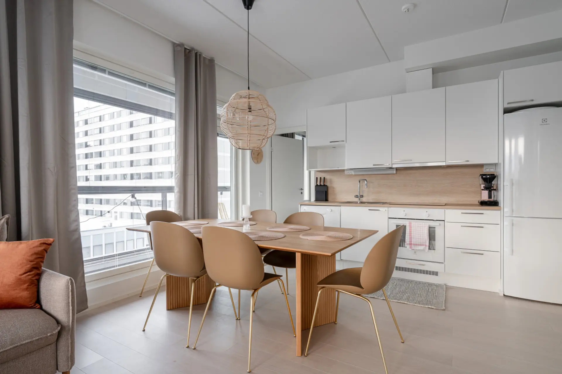 The open-concept layout and large windows create a bright, inviting space where you can work or dine comfortably.