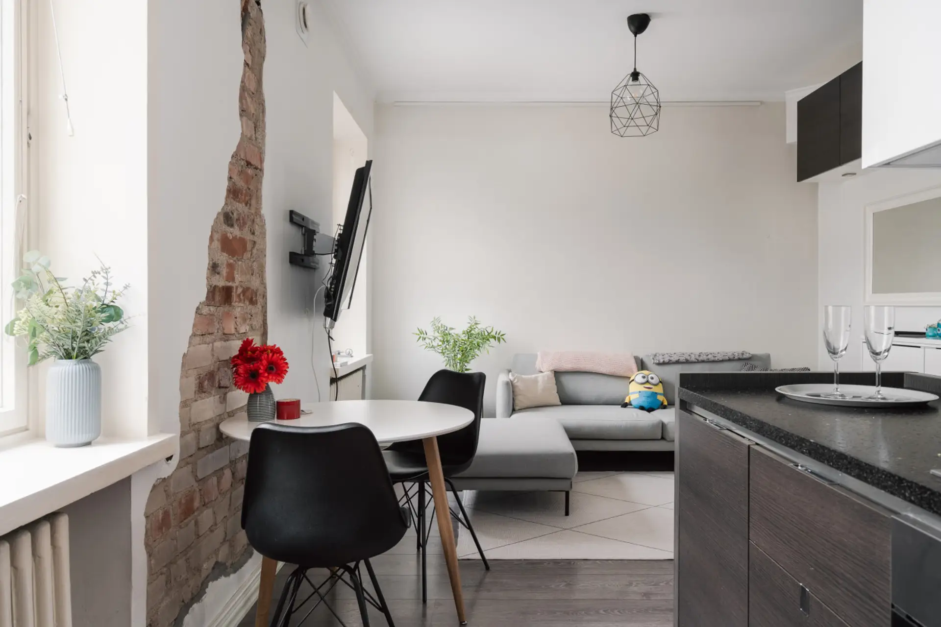 Open-plan living space with warm lighting and a calming neutral palette for a true home-away-from-home.