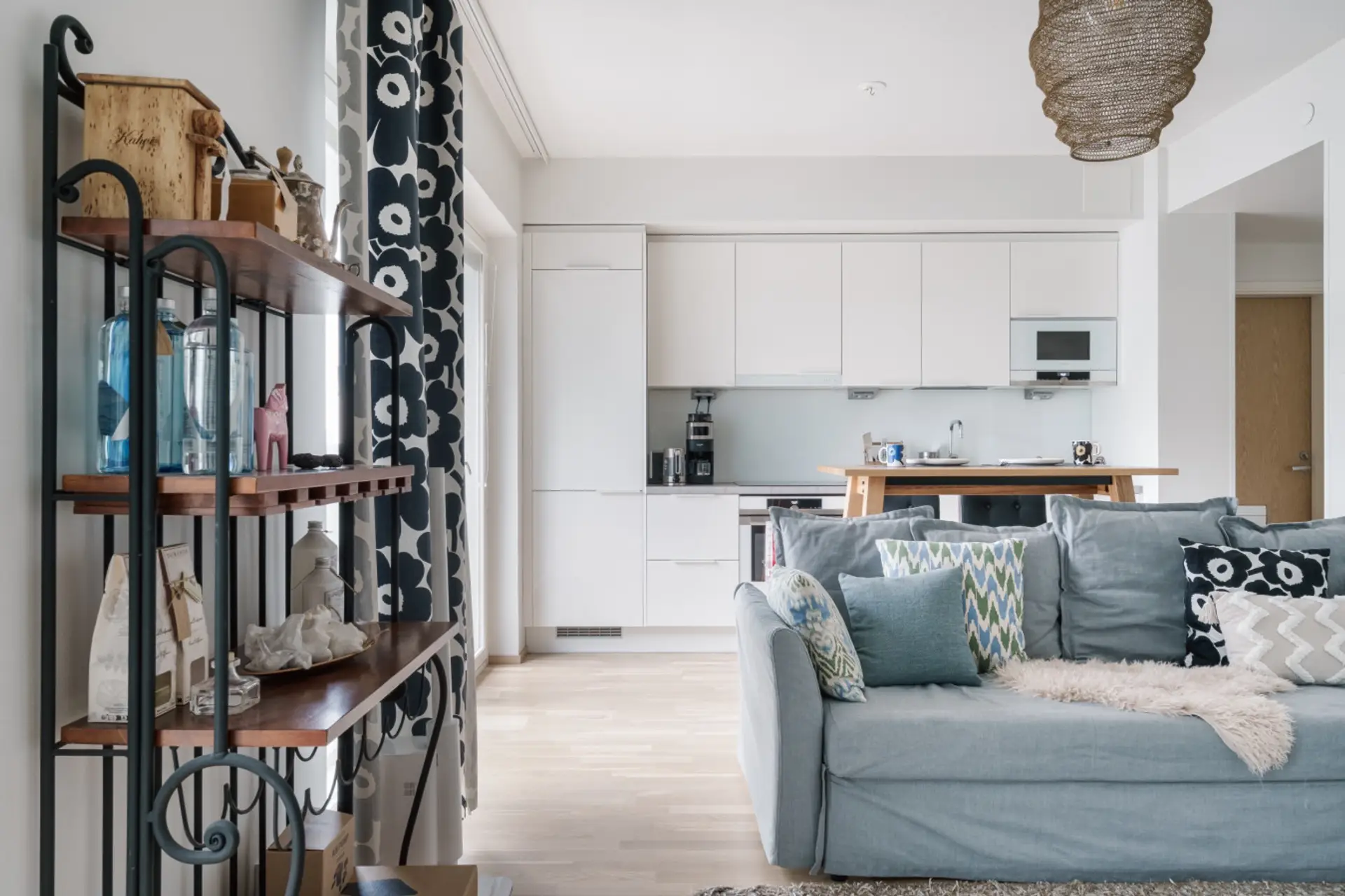 Bright living room filled with natural light and a comfortable seating area for relaxing.