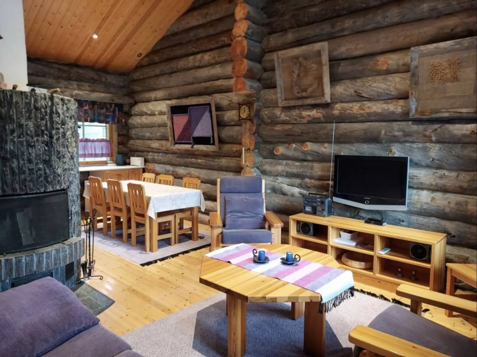 Living room with television, seating and dining area