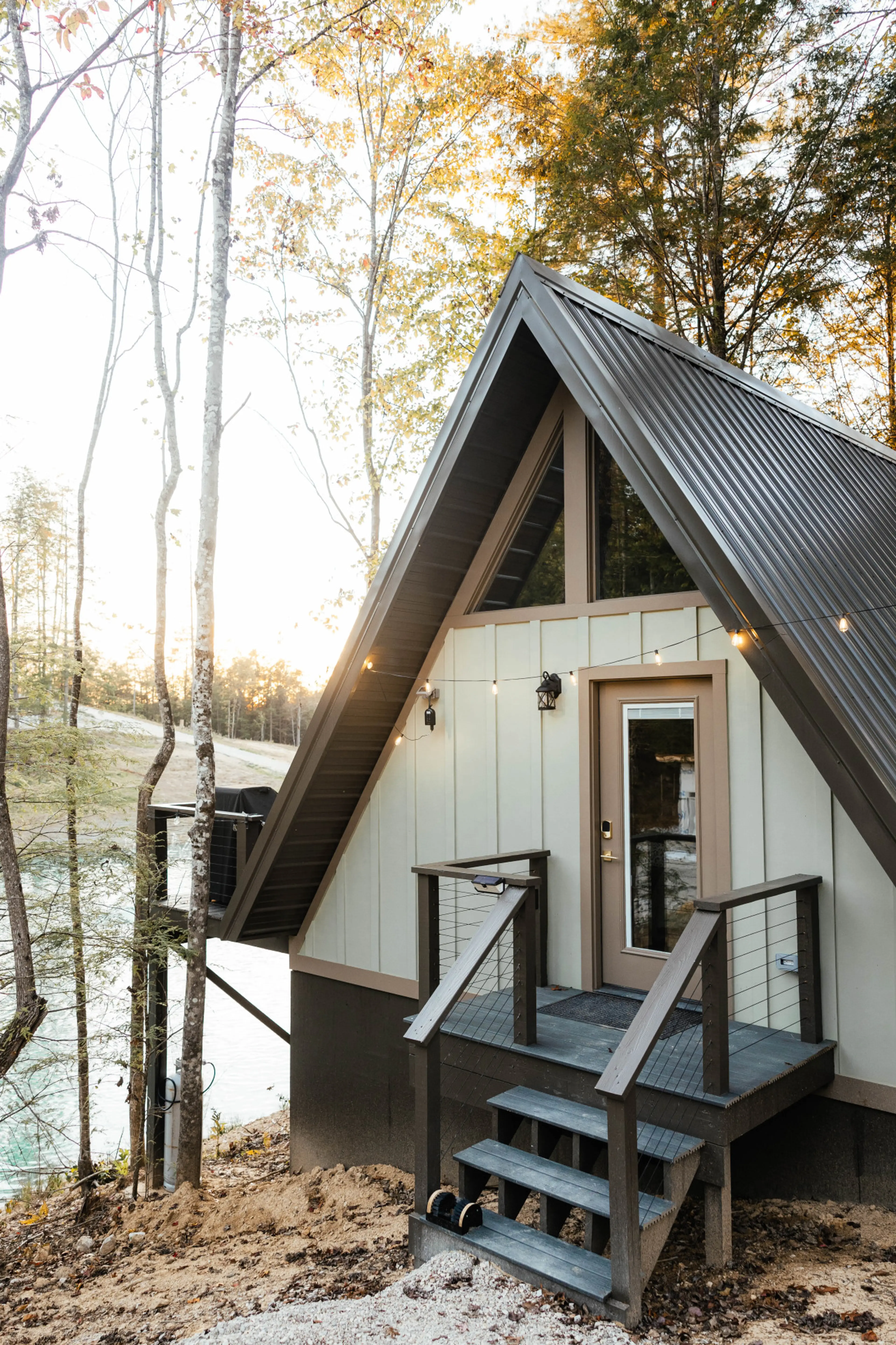 Charming A-frame cabin nestled beside the pond with a private deck and peaceful wooded surroundings