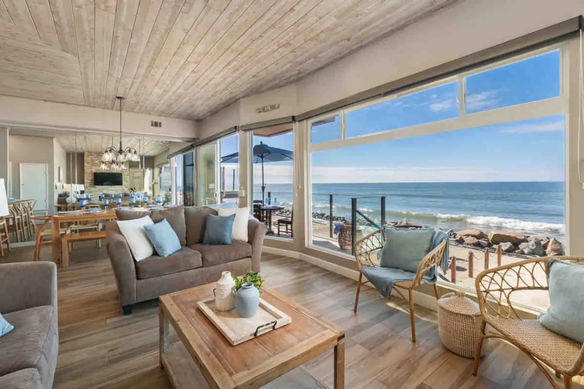"Oceanfront living room with panoramic views and the sound of waves throughout the home.