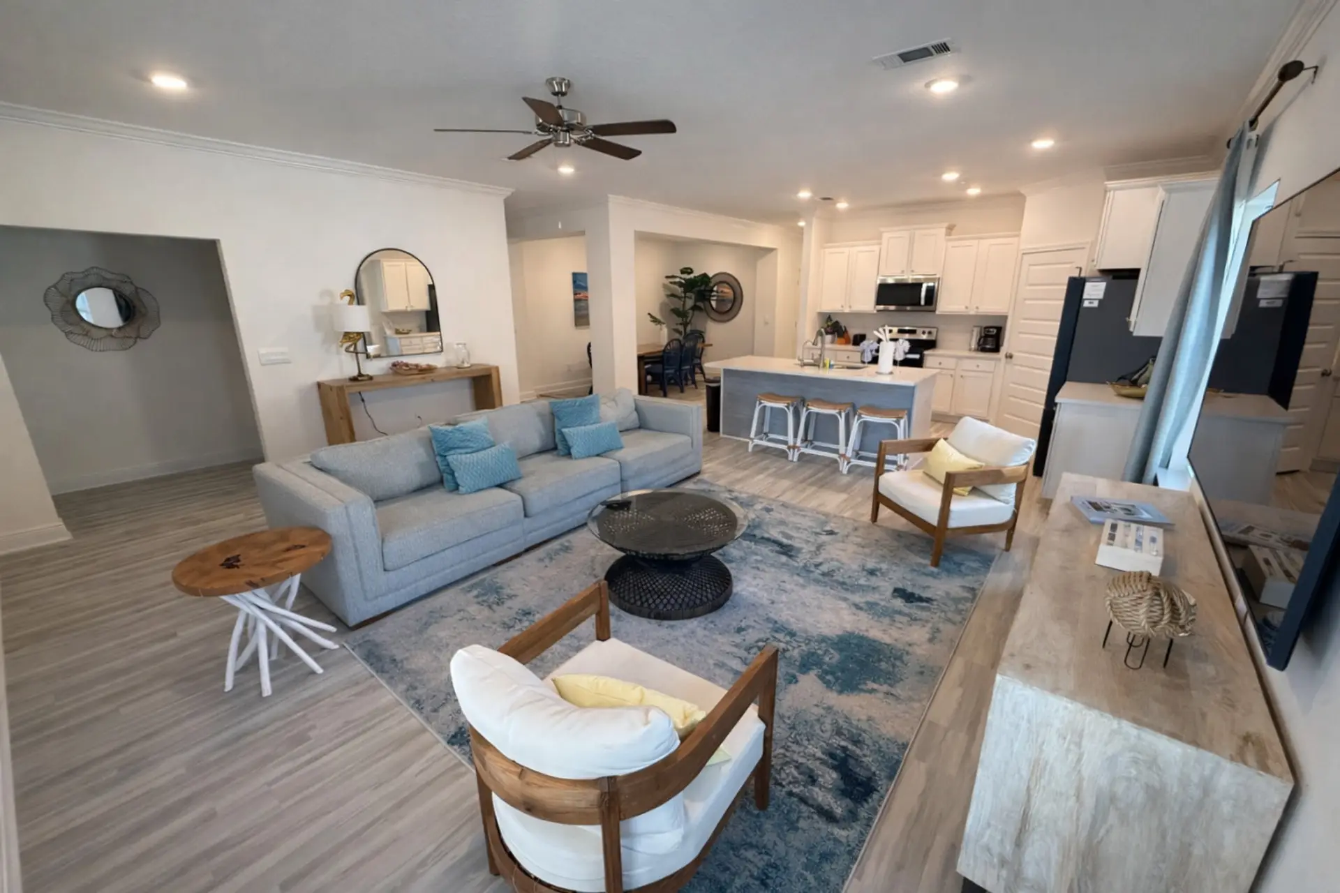Sunlit open living room with coastal blues