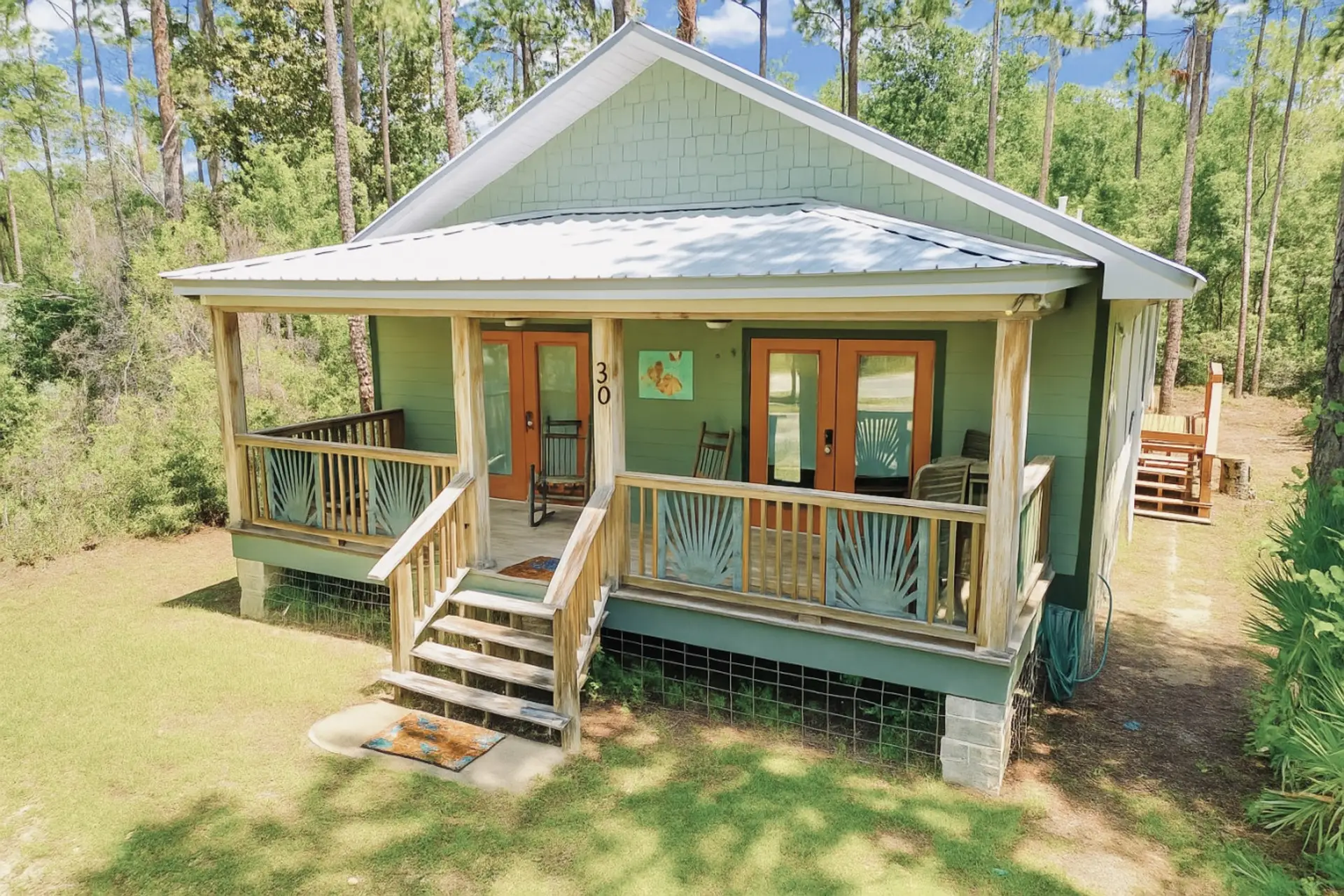 Welcoming porch with rocking chairs and palm railings