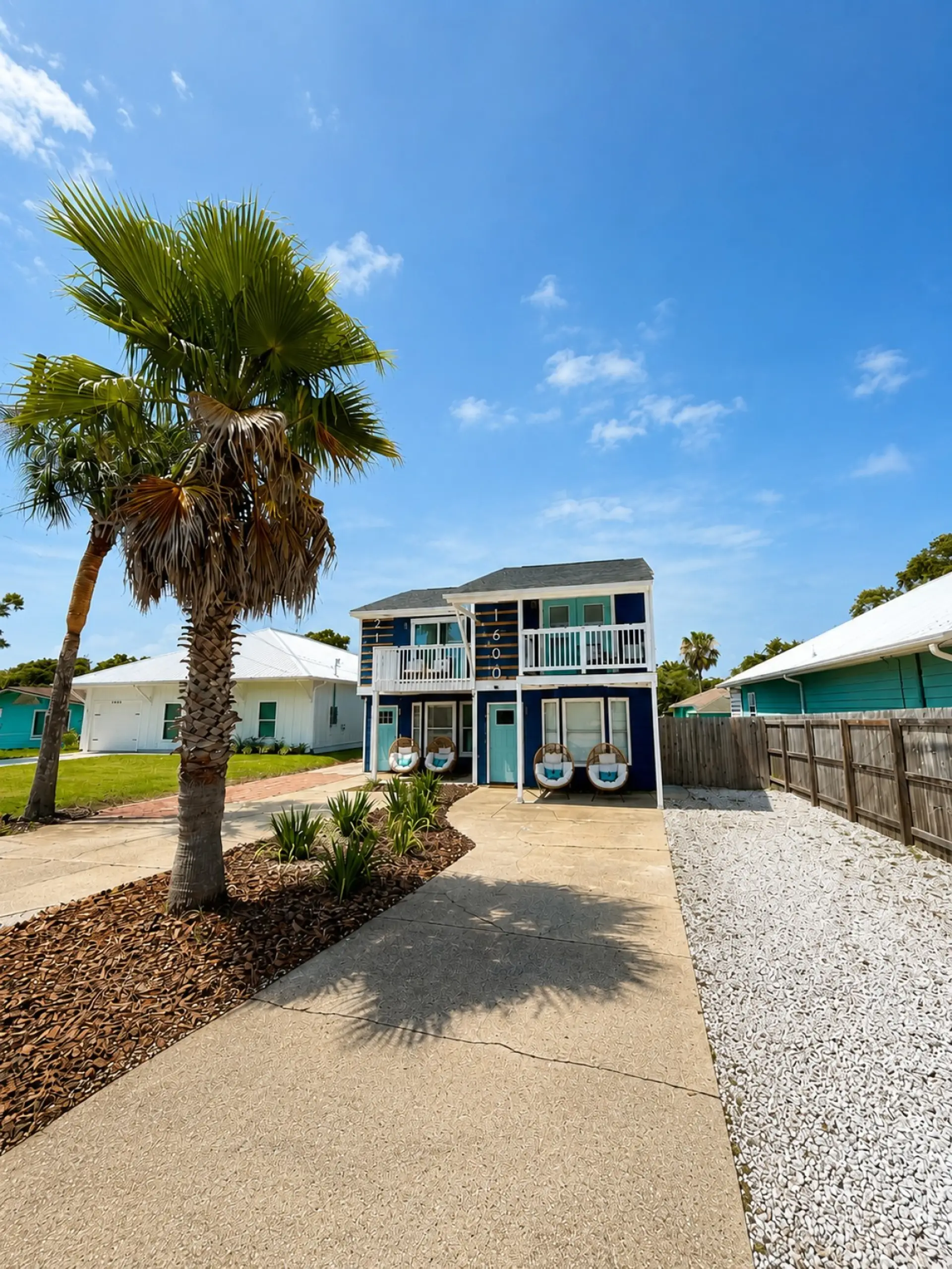 Welcome to the Blue-jee Twin Compound — two side-by-side beach houses ready for your whole group.