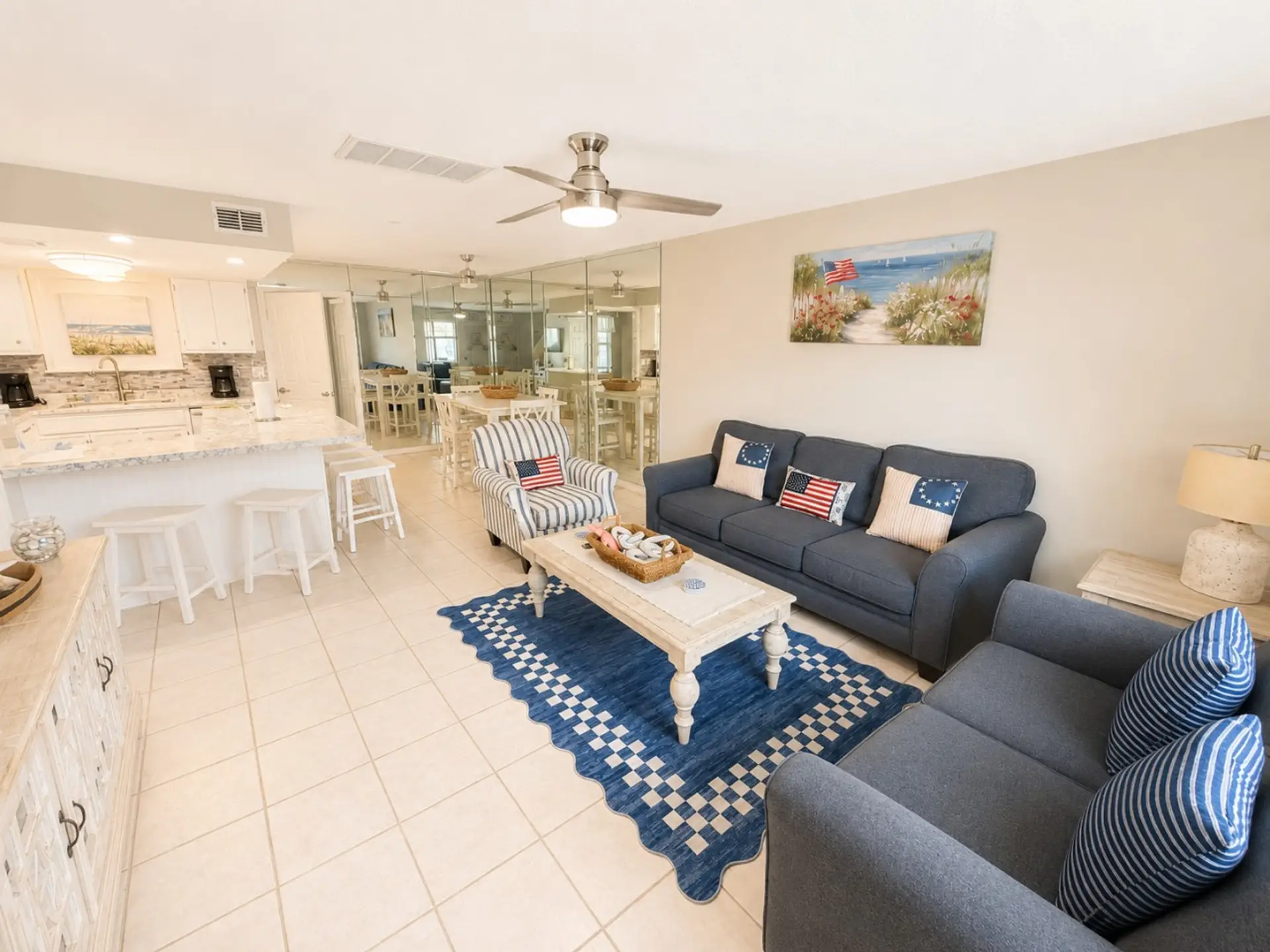 Navy sofas and kitchen peninsula in open great room