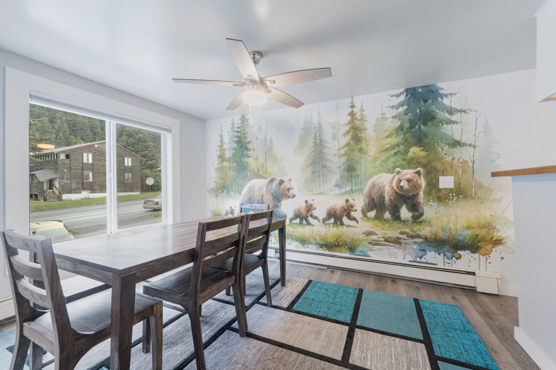 Unique and fun bear mural over a dining table that seats the whole group