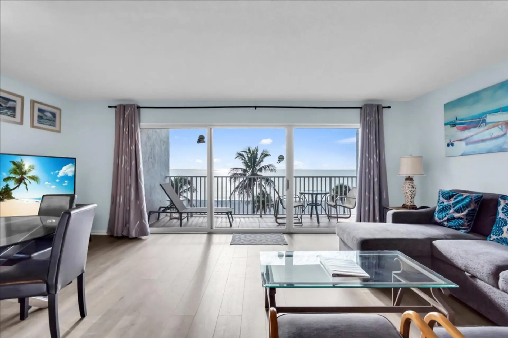 The living-room photograph showing the Gulf through the windows