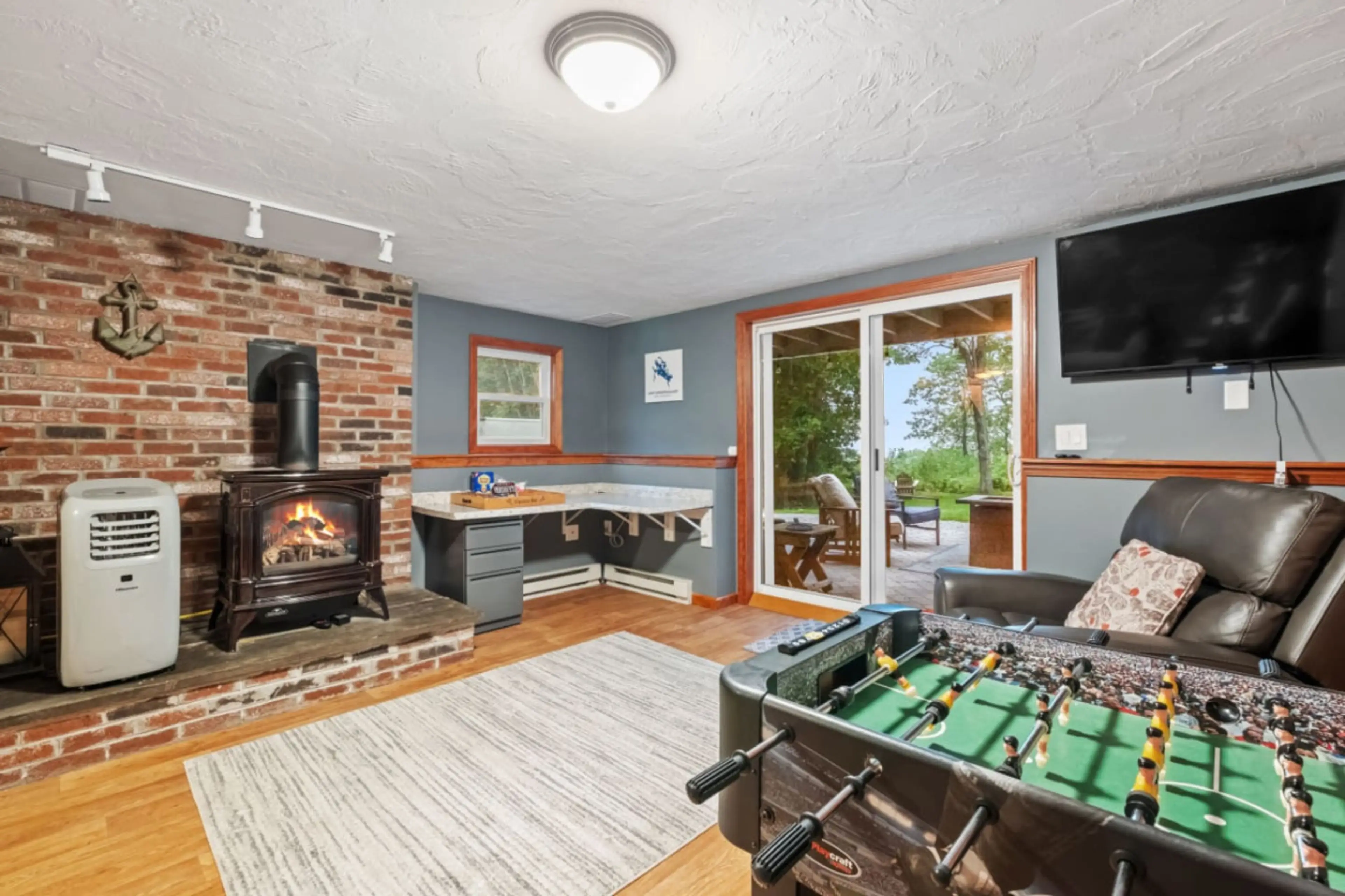 Inviting family room with comfortable seating and a warm fireplace atmosphere.