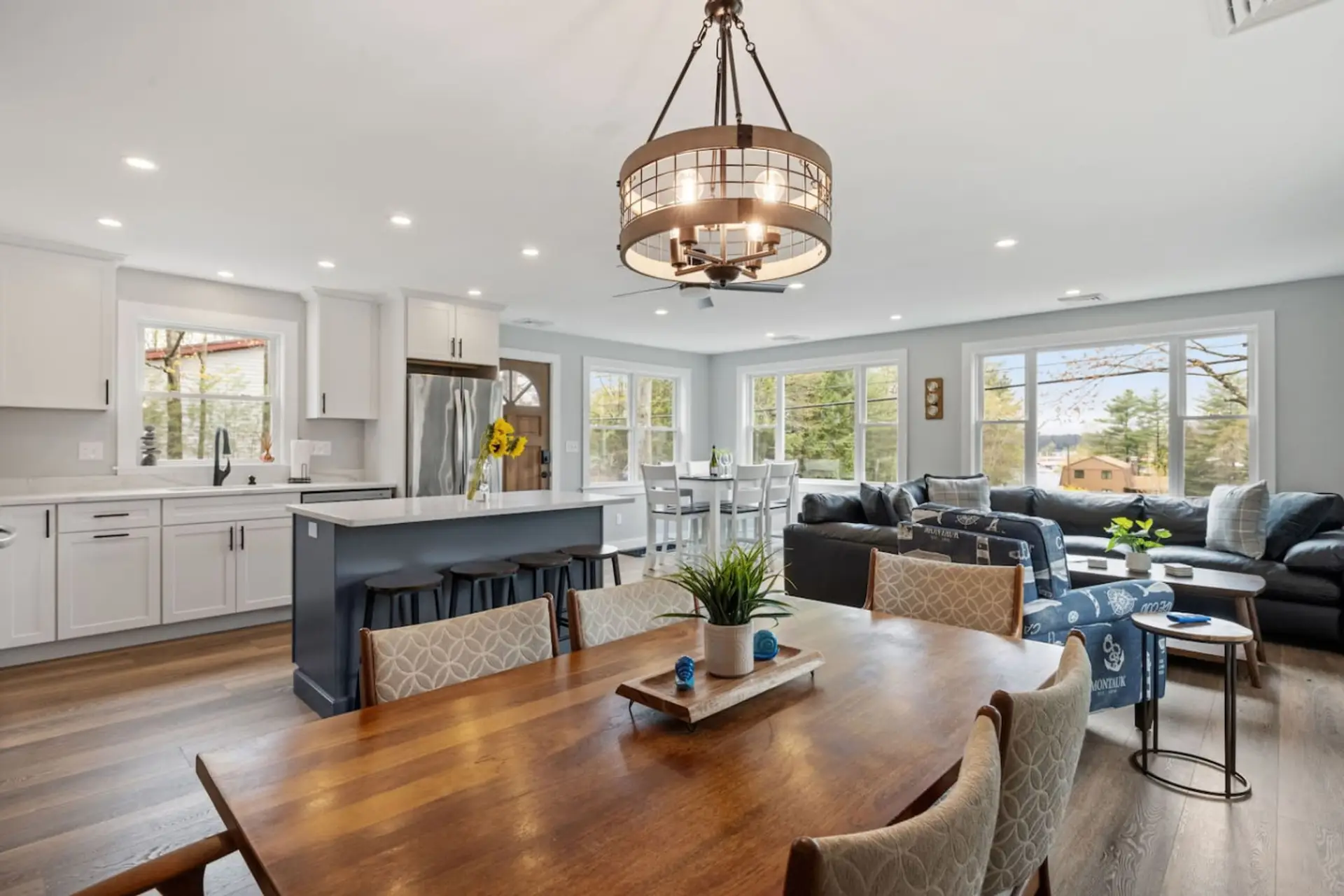 Spacious kitchen and living room with natural light and modern style