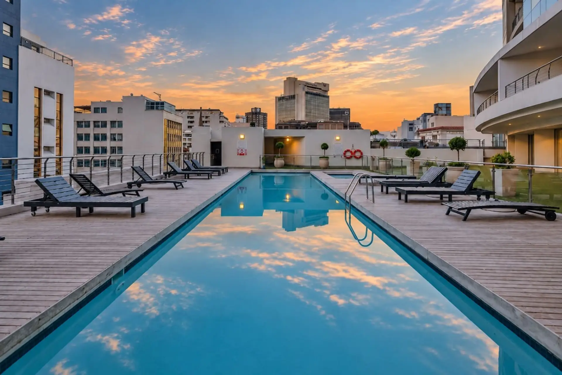Skyline Swim: Enjoy a refreshing rooftop pool framed by open city views, with poolside loungers providing an ideal setting to relax as daylight fades.