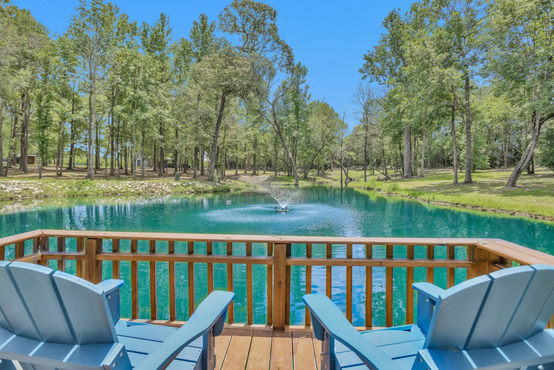 Water view of Blue Pond from the dockside Adirondack Chairs