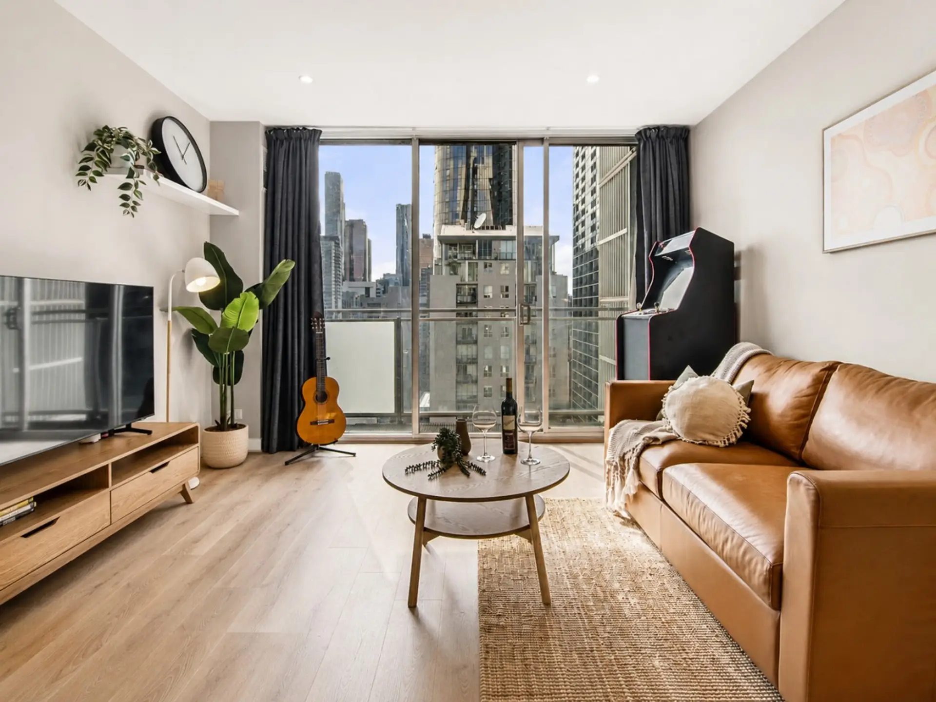 Relax in a sun-filled lounge with stunning Melbourne skyline views.