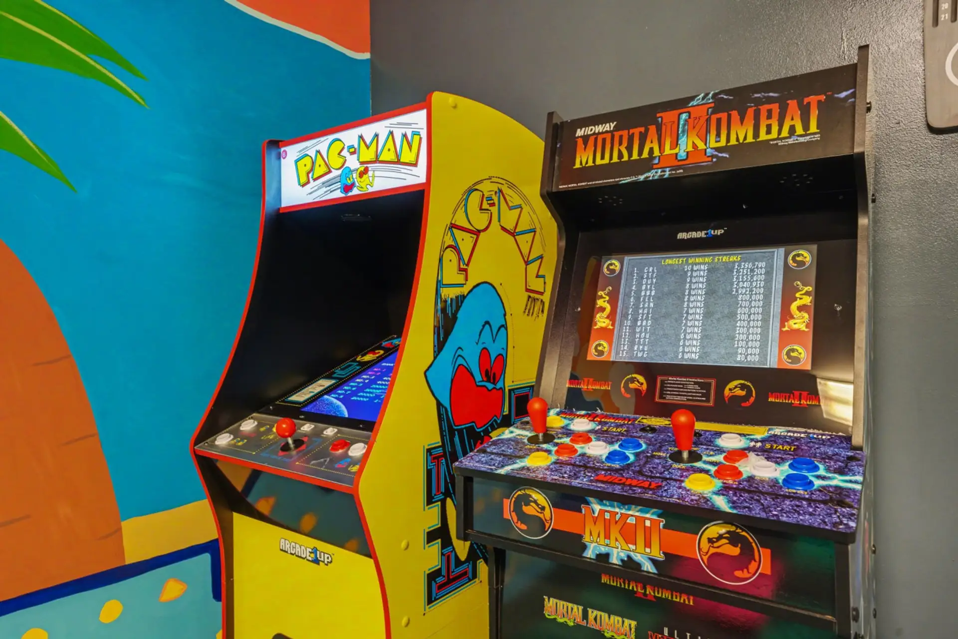 Unique private garage arcade room featuring classic and modern gaming cabinets.
