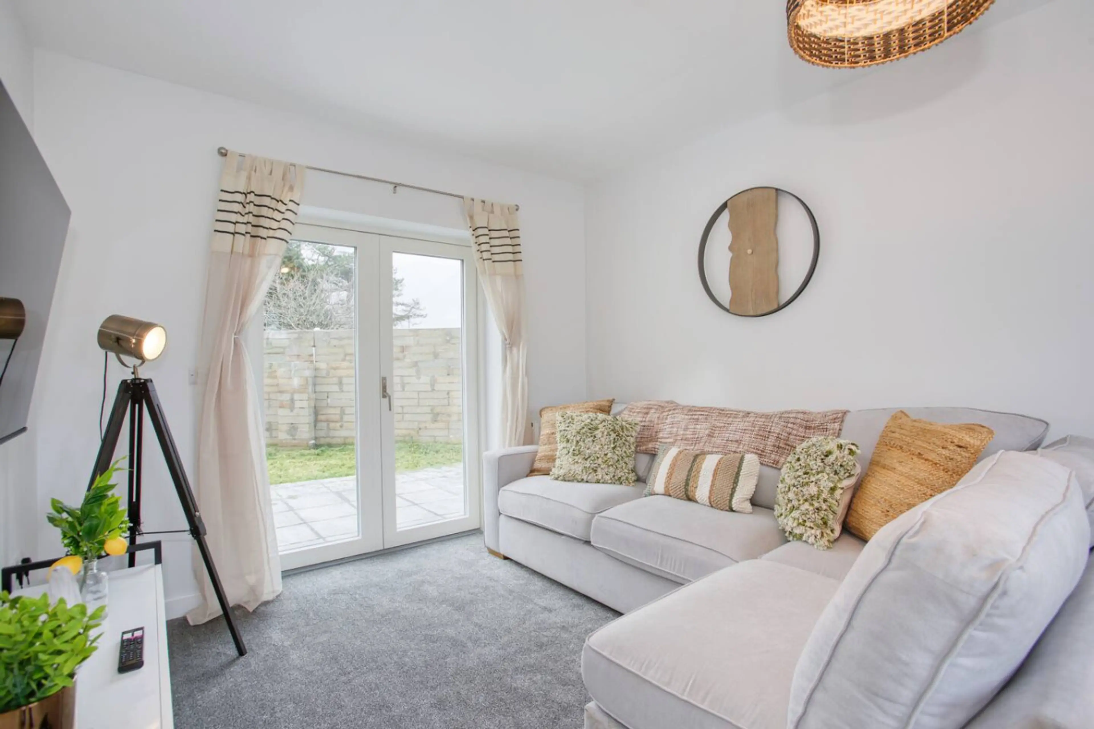 Contemporary lounge featuring a roomy sofa, large flat-screen TV, plus Sky and Netflix.
