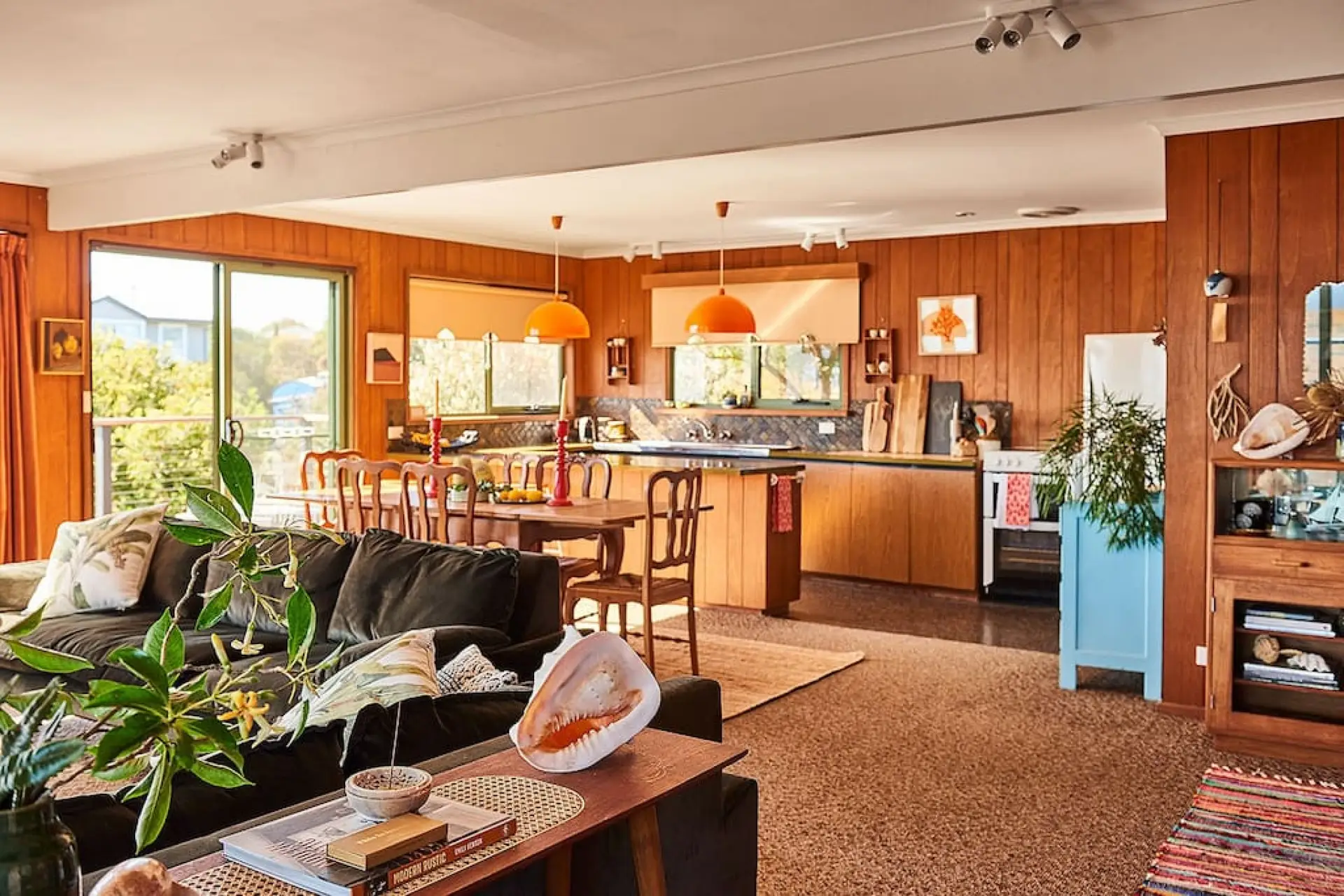 Spacious open-plan kitchen, living and dining space that open out to the sun-drenched deck making the most of the ocean views