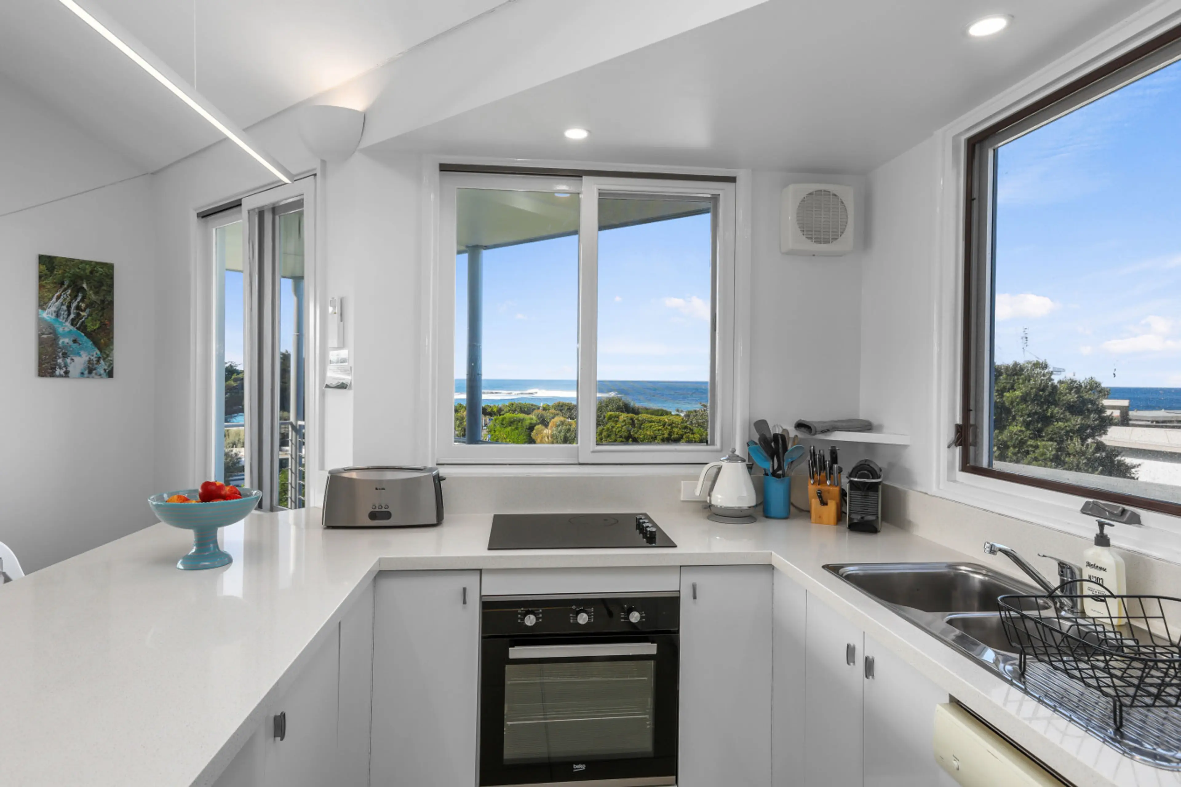 Light filled, fully equipped kitchen with stunning view
