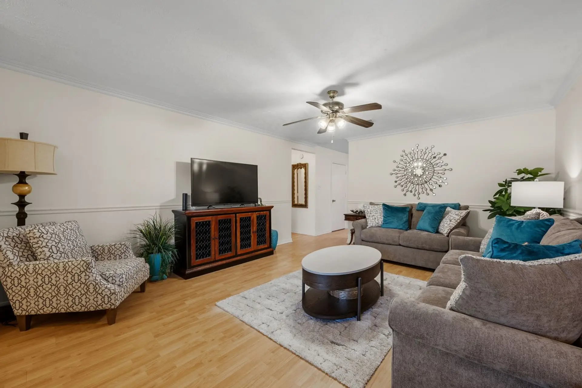 Settle into the living room with two couches, an armchair, and a TV.