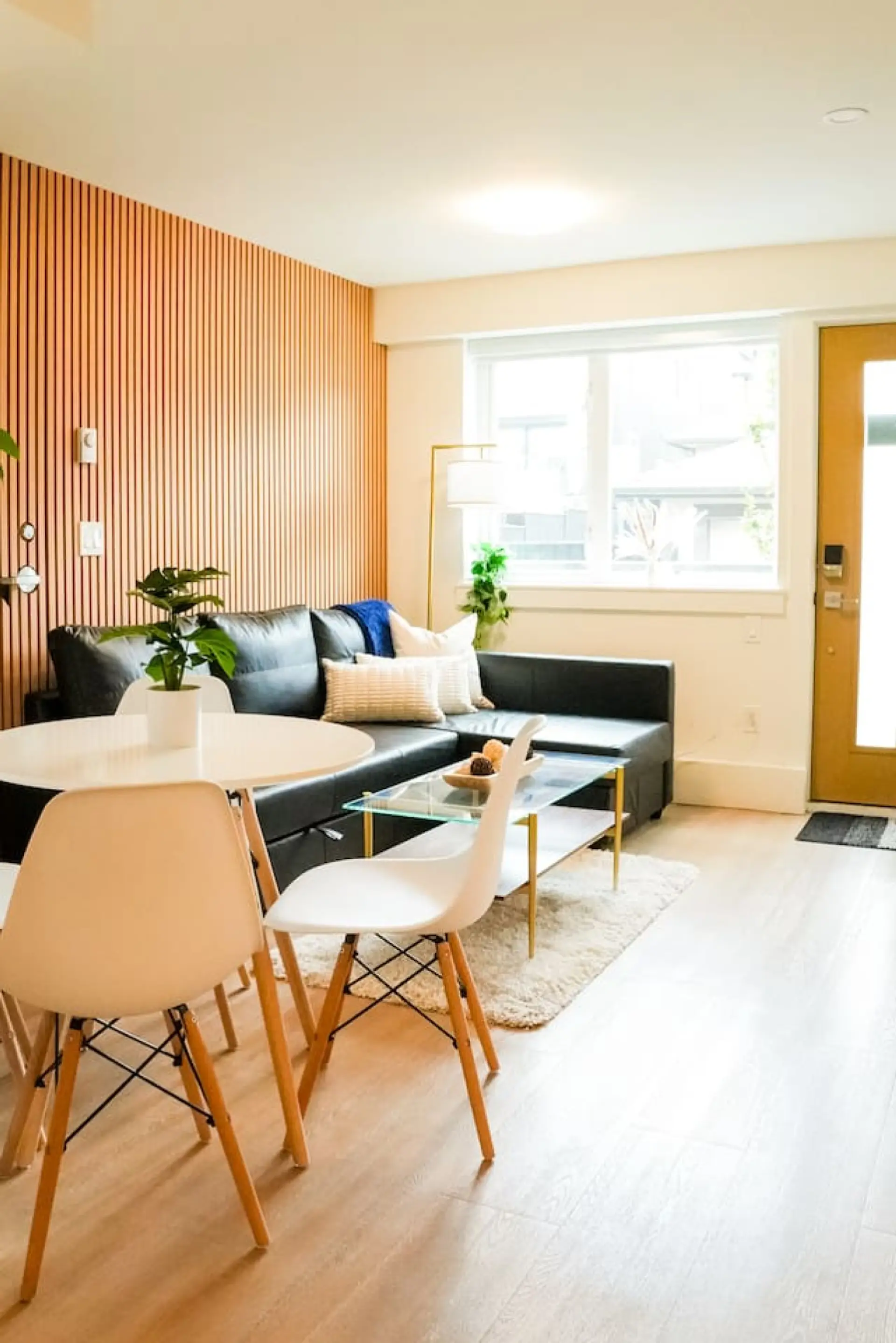 A cozy and stylish living room designed for relaxation with seamless wood tones