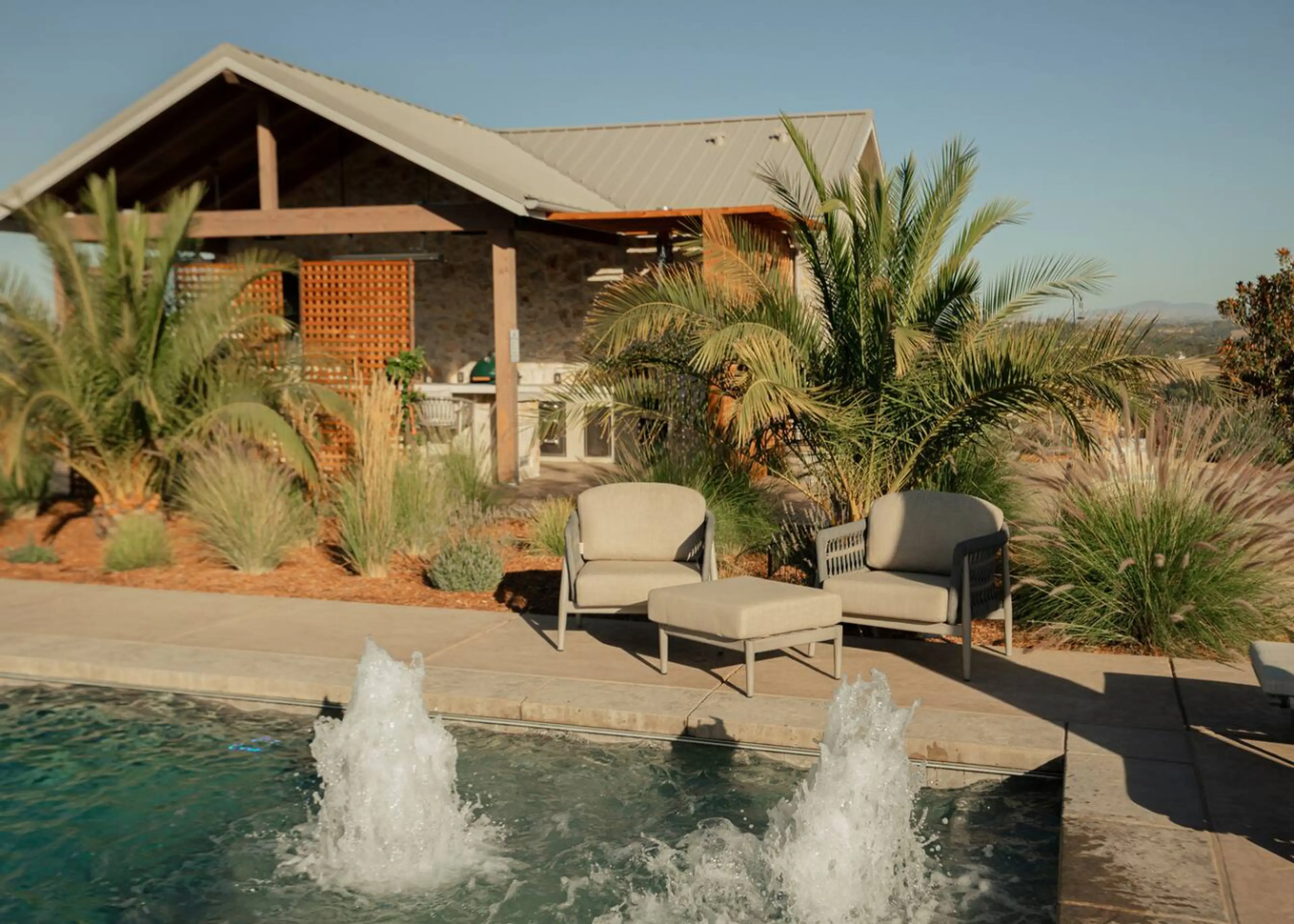 Welcome to Kiler & Vine -Take a refreshing swim while soaking in vineyard views. Sparkling fountains and comfortable lounge seating make this pool a perfect sunny day escape.