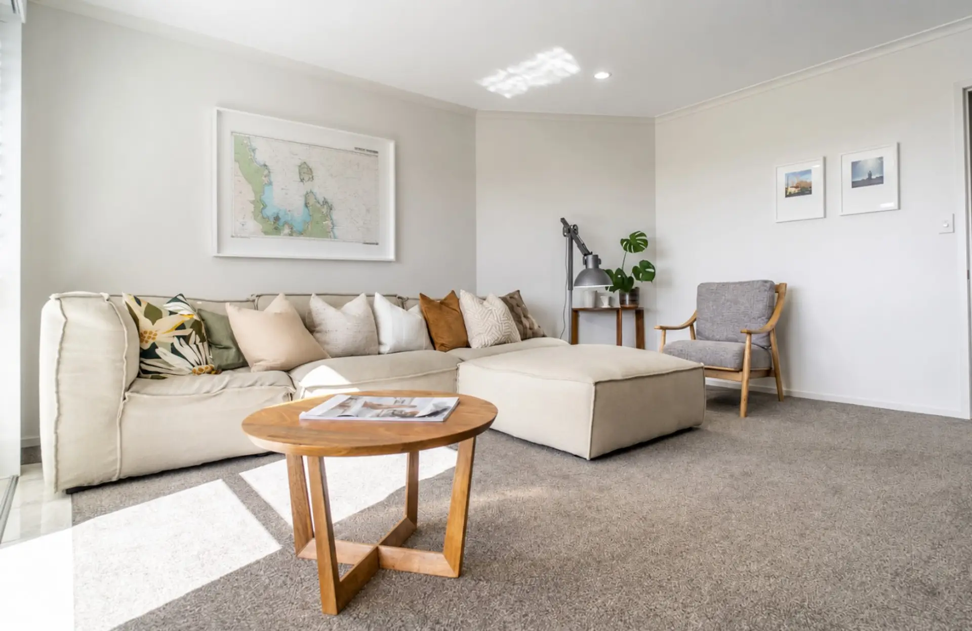 One of two inviting living areas, this comfortable lounge features a smart TV, cosy seating, and access to the east-facing balcony. Stylish shutters provide privacy while filtering the morning sun.