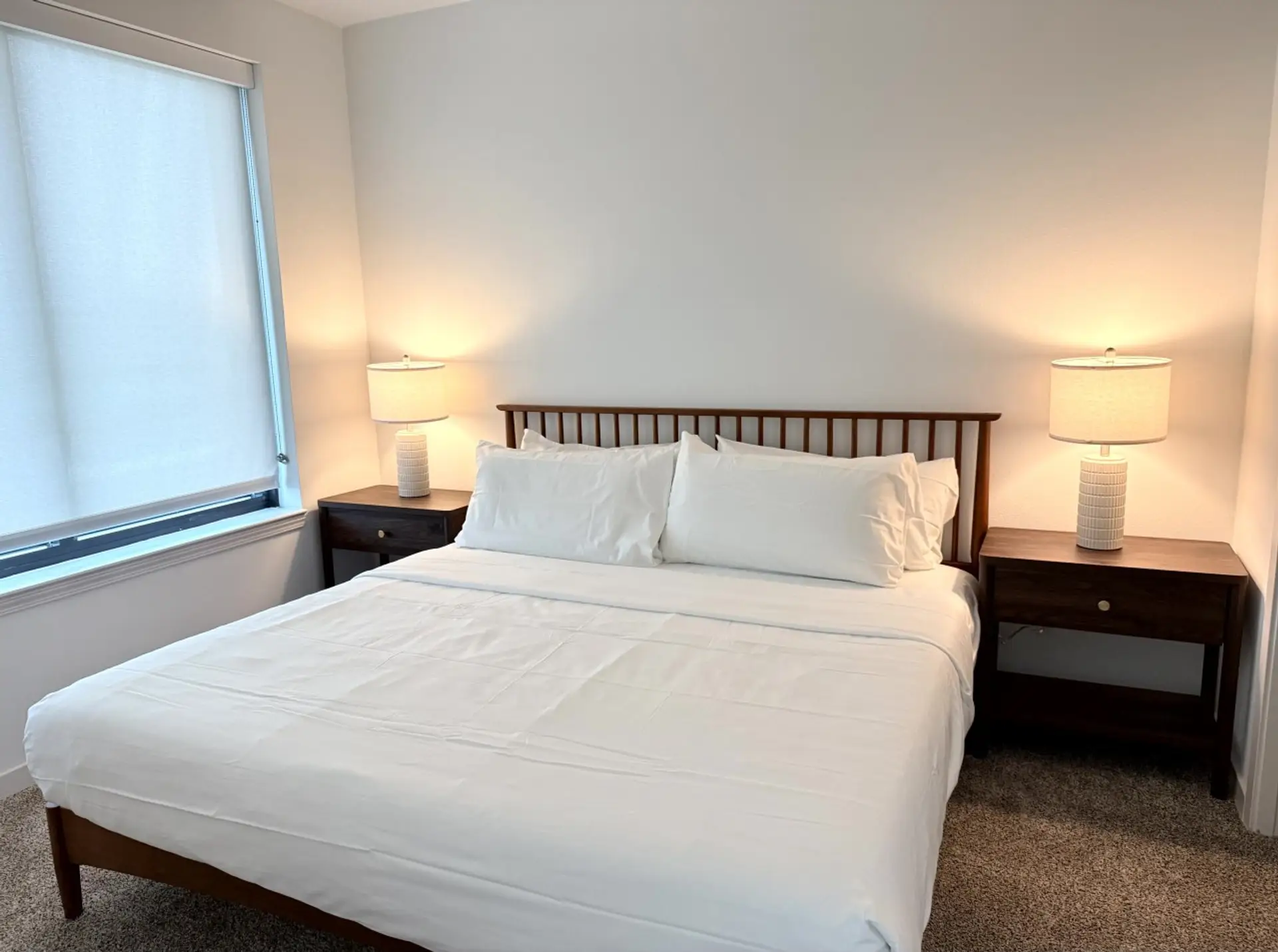 Unwind in the quiet, private bedroom featuring a comfortable King-size bed, premium linens, and room-darkening shades
