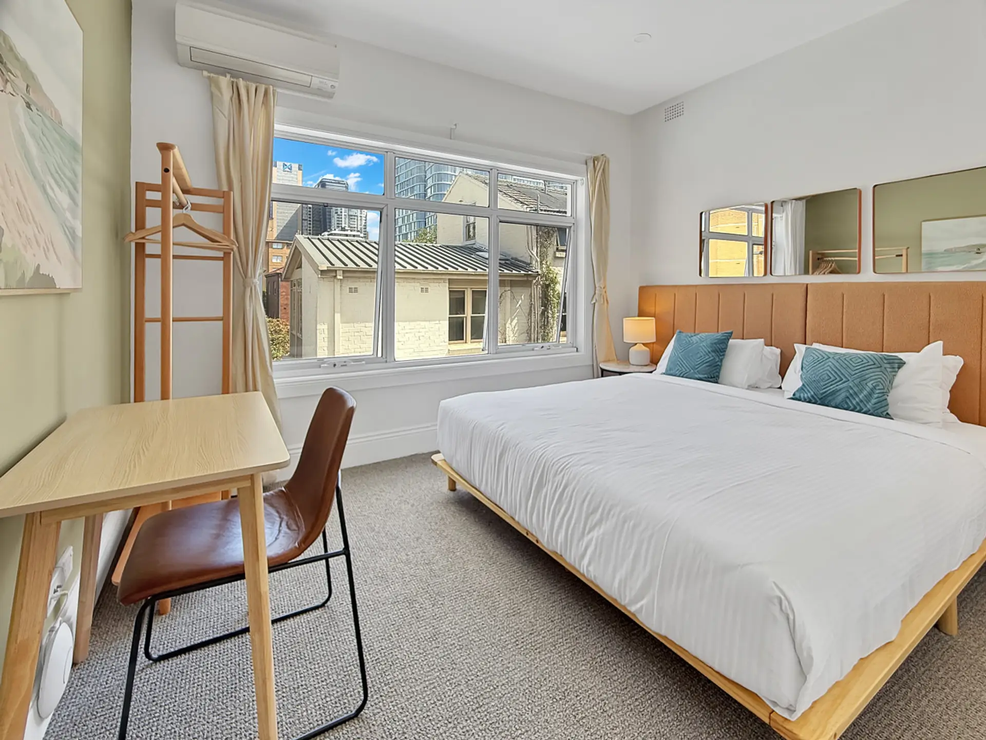 large king bed with pillow topped mattress and sun drenched window