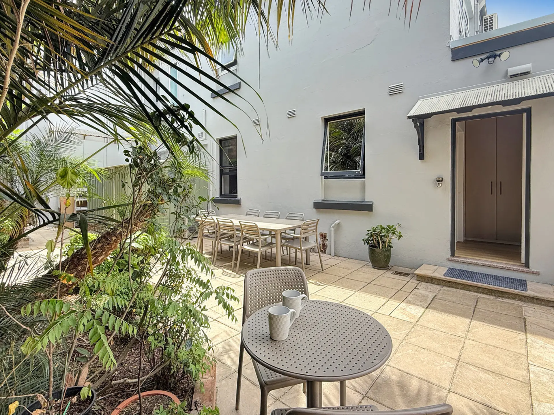 outdoor courtyard showing the door to the unit