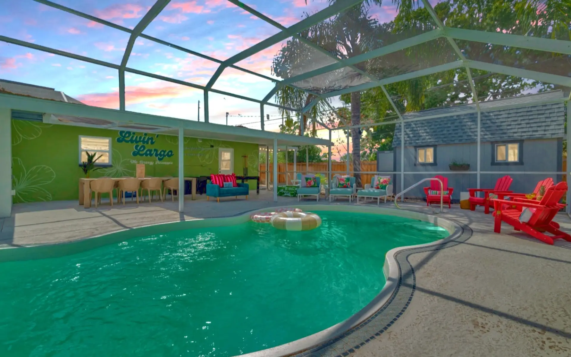 Soak up the Florida sun at The Breezy Pineapple — your private pool, lounge seating, and ‘Livin’ Largo’ mural oasis await.