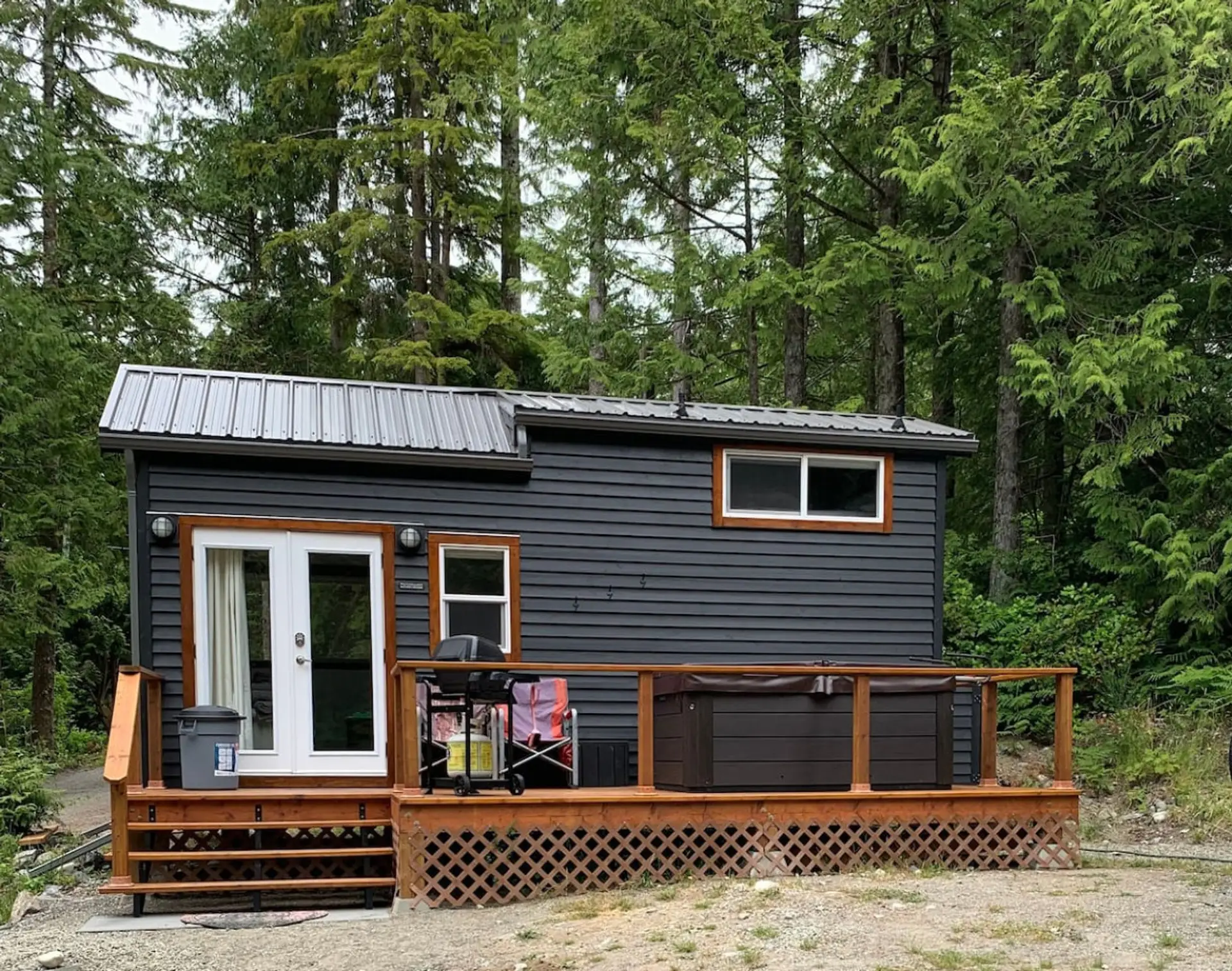 Tranquil Tiny Home deck with seating, hot-tub and BBQ