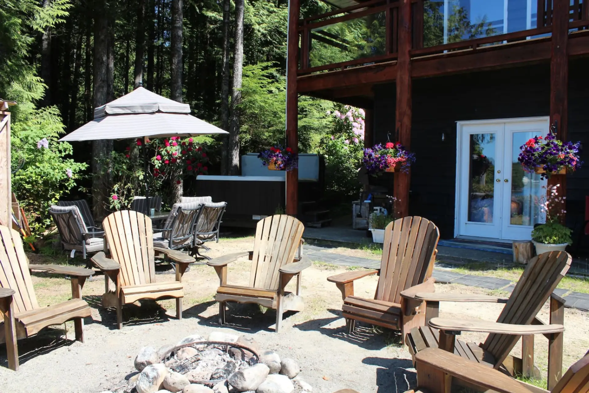 King Cove room entrance with hot tub and fire-pit