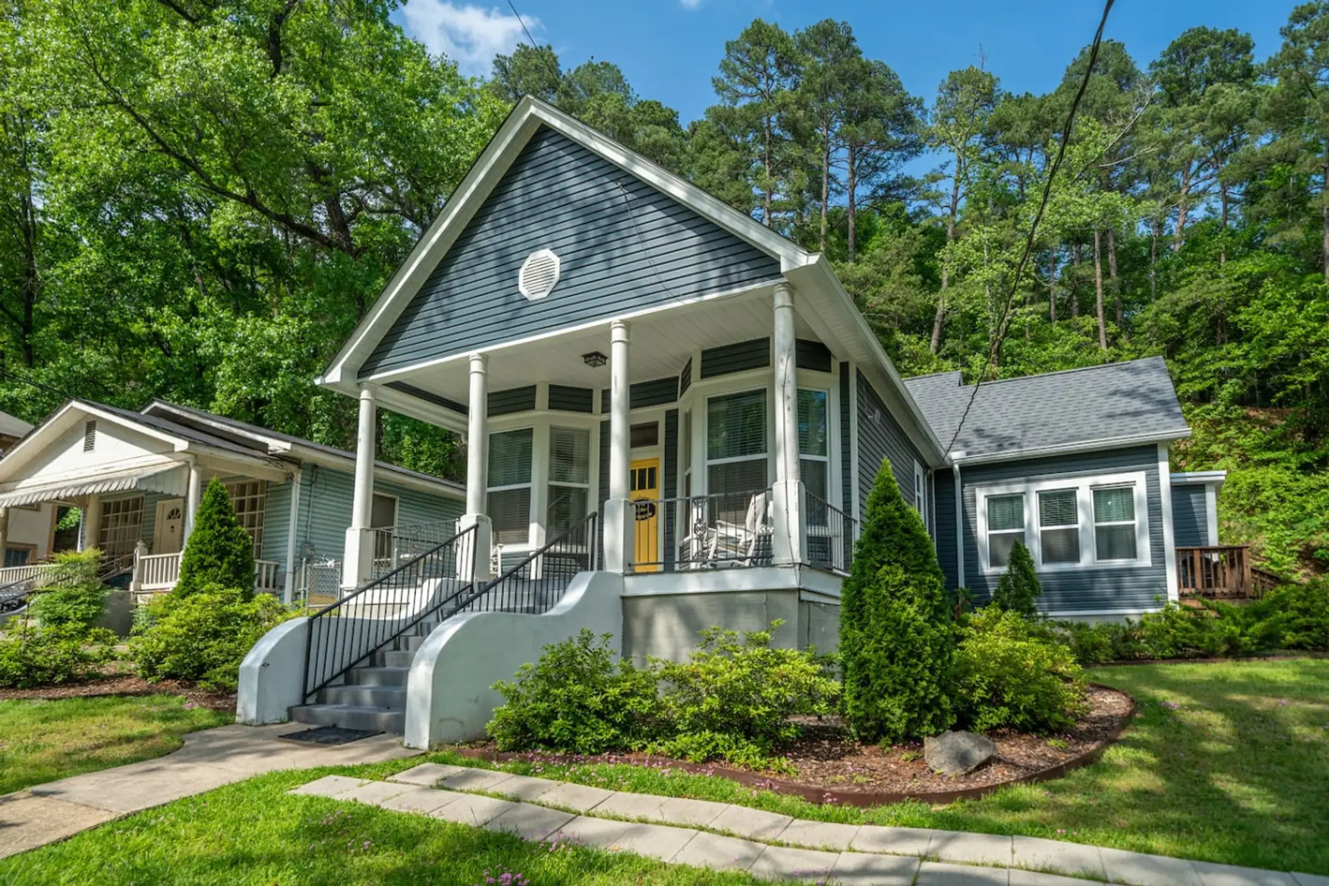 This house has two, fully self contained units.  Big Cedar is the largest and the entrance faces the street.  Just look for the yellow door.  There is also a duplex on the other side of the driveway with two additional units.