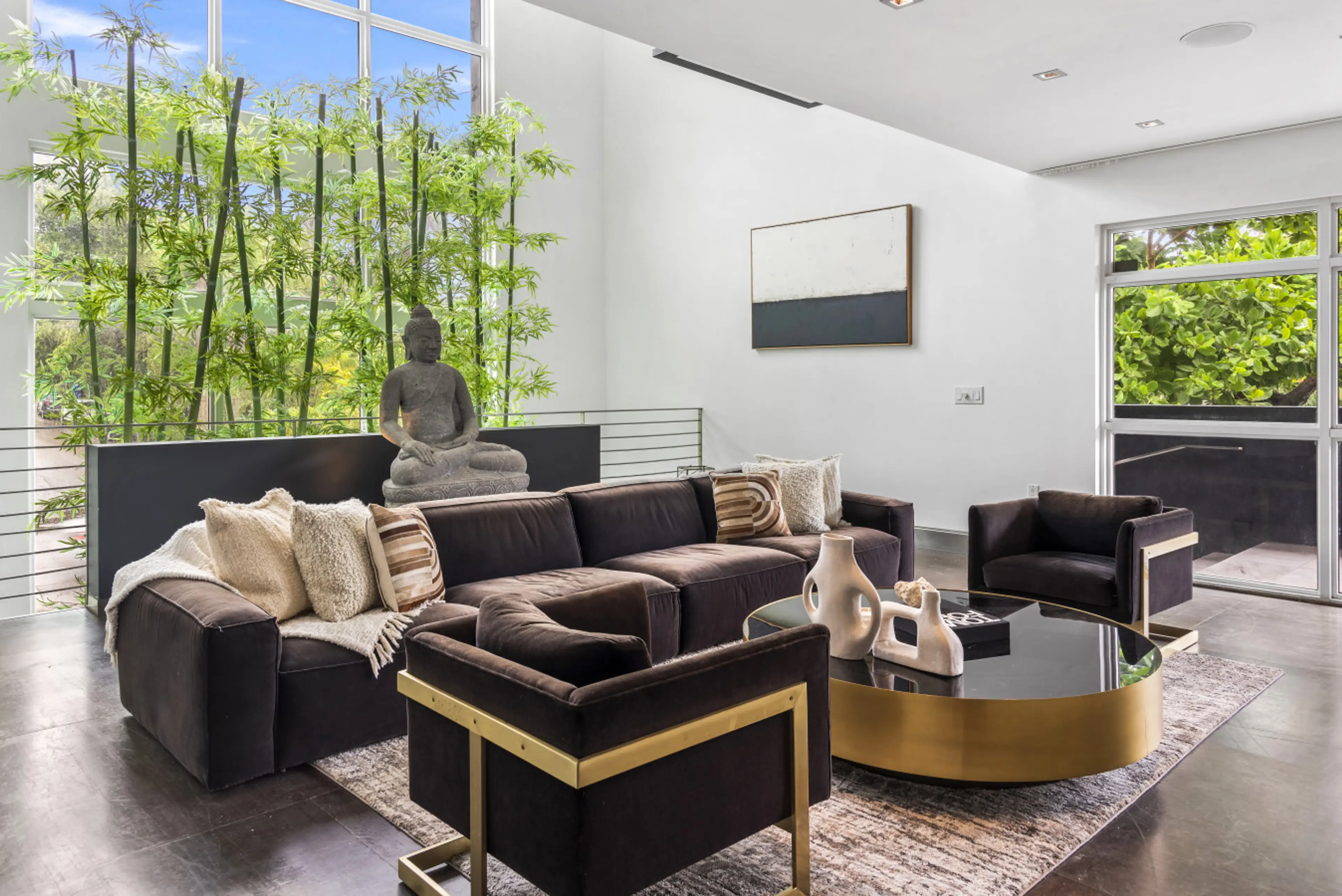 Contemporary Zen Living Area with Buddha Statue Premium Furnishings and Tropical Views
