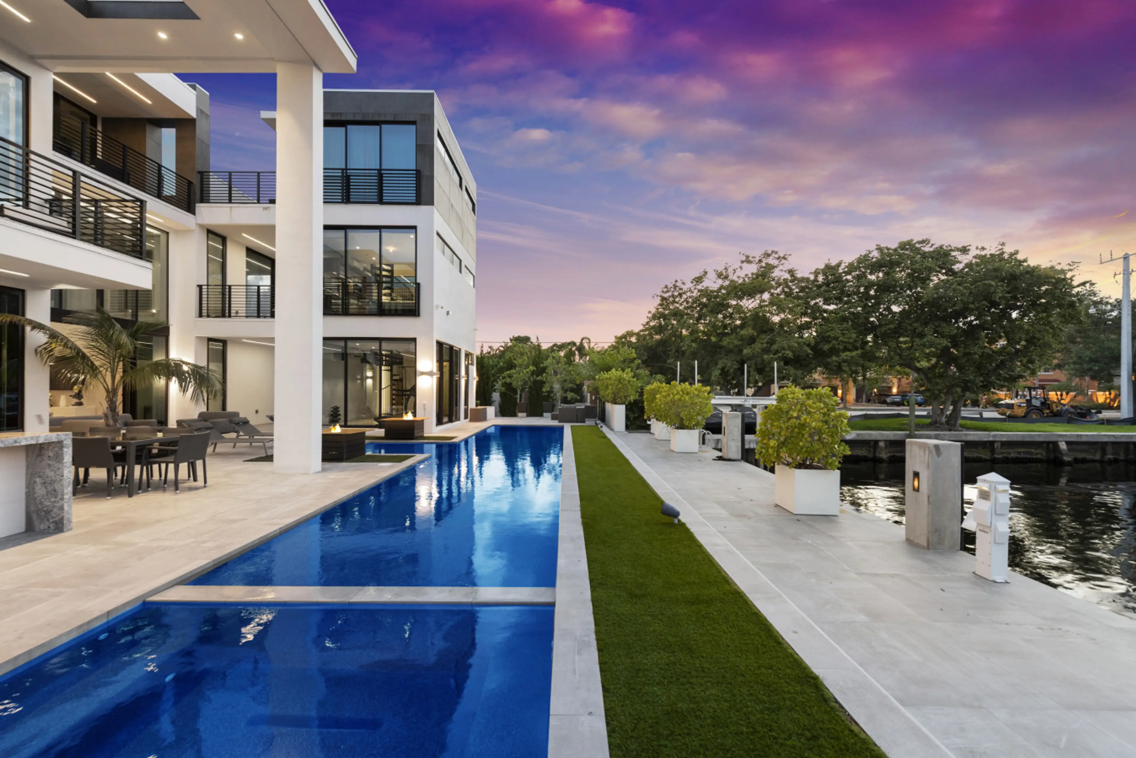 Exclusive waterfront oasis with extended pool and beautiful sunset backdrop